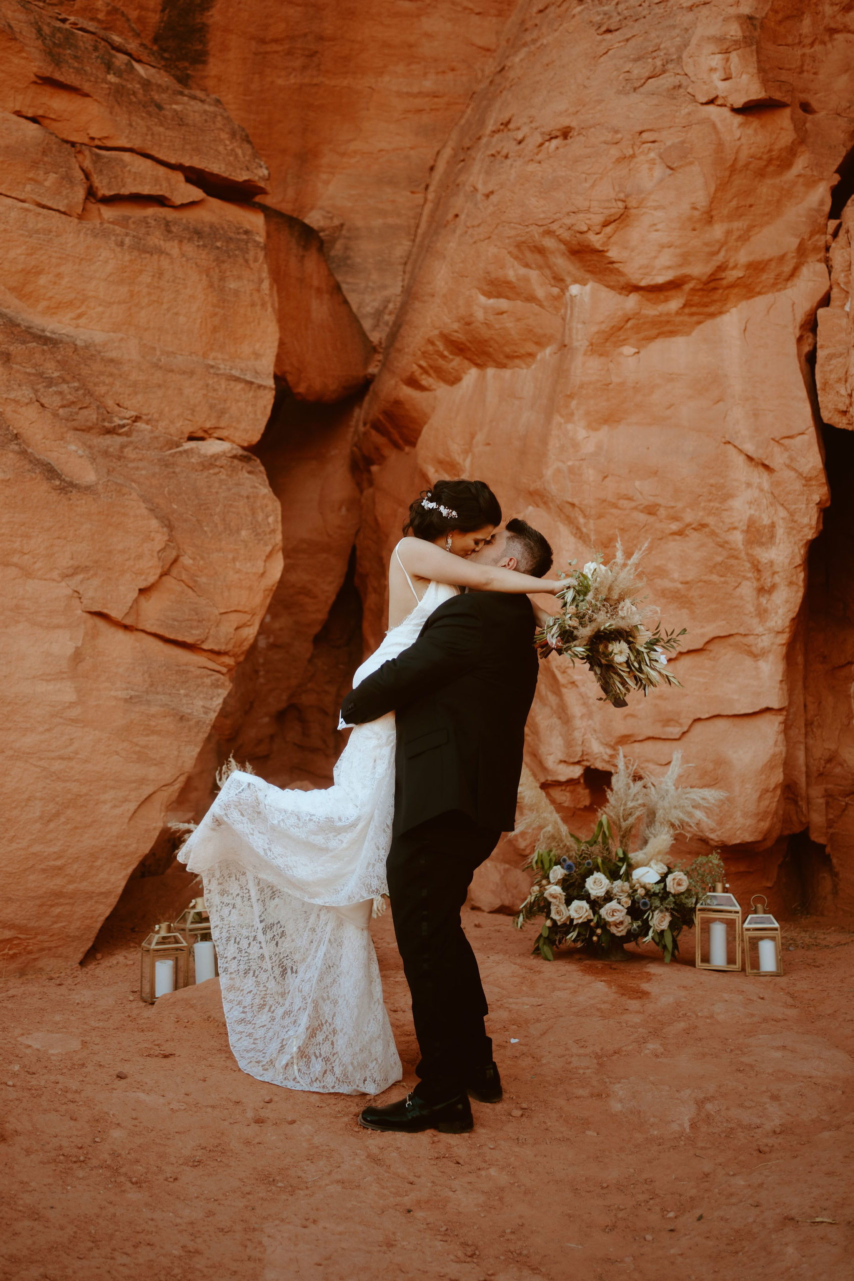 Grooming Picking Bride up and Kissing Her during Just Outside of Las Vegas Elopement 