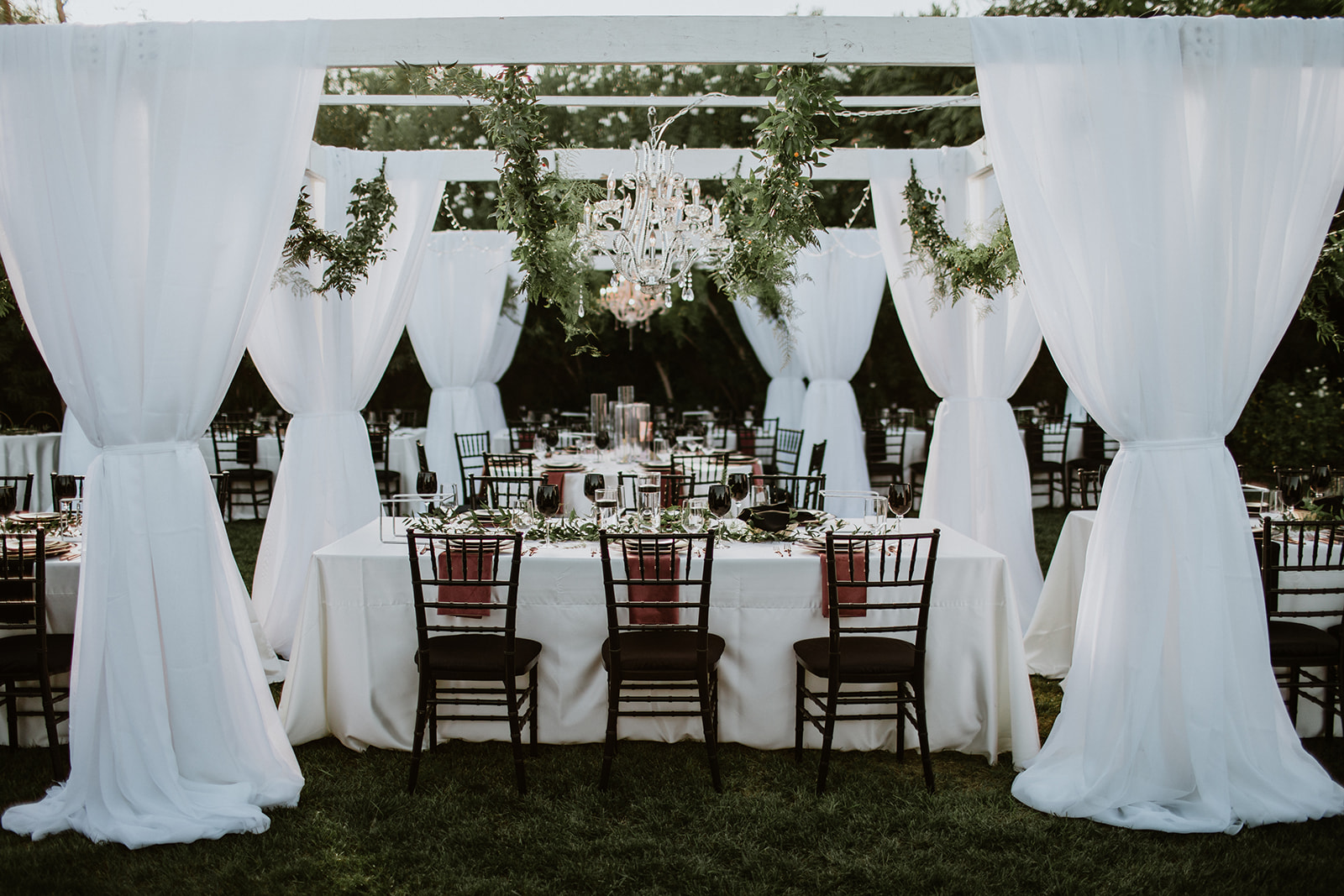 Moody Modern Glam Lotus House Wedding Reception tablescape with chandelier