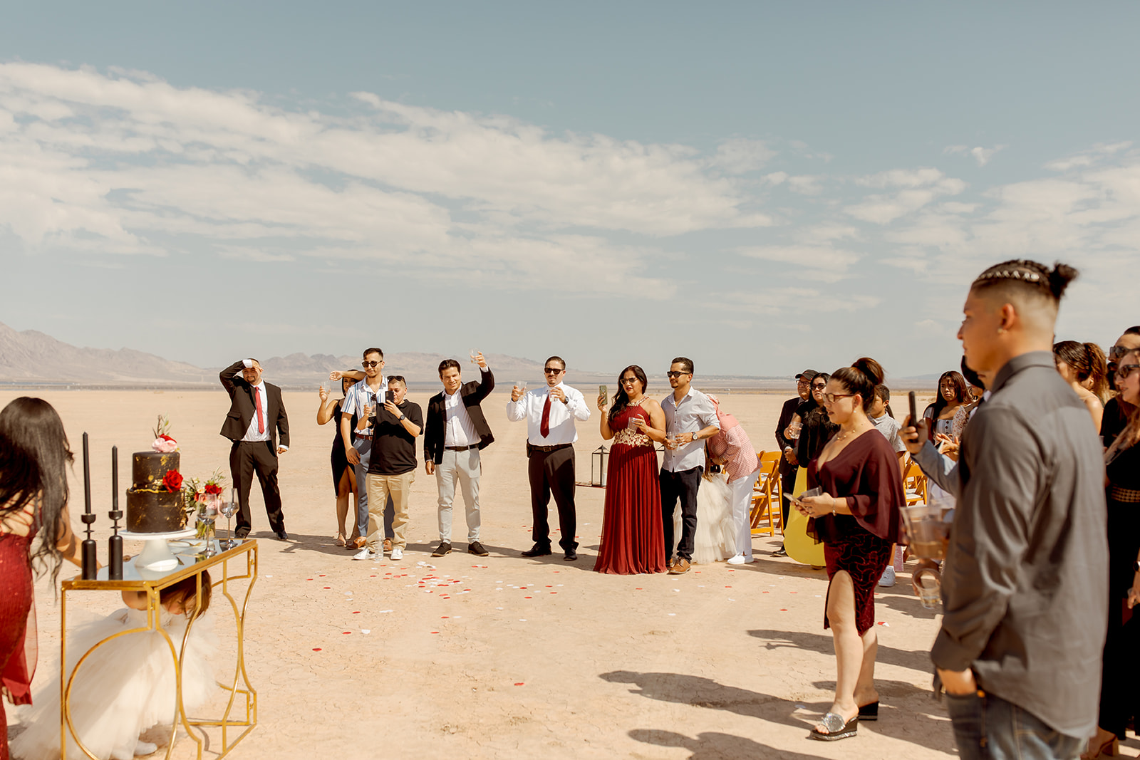 Guests doing Champagne Toast at Moody Dry Lake Bed Elopement 
