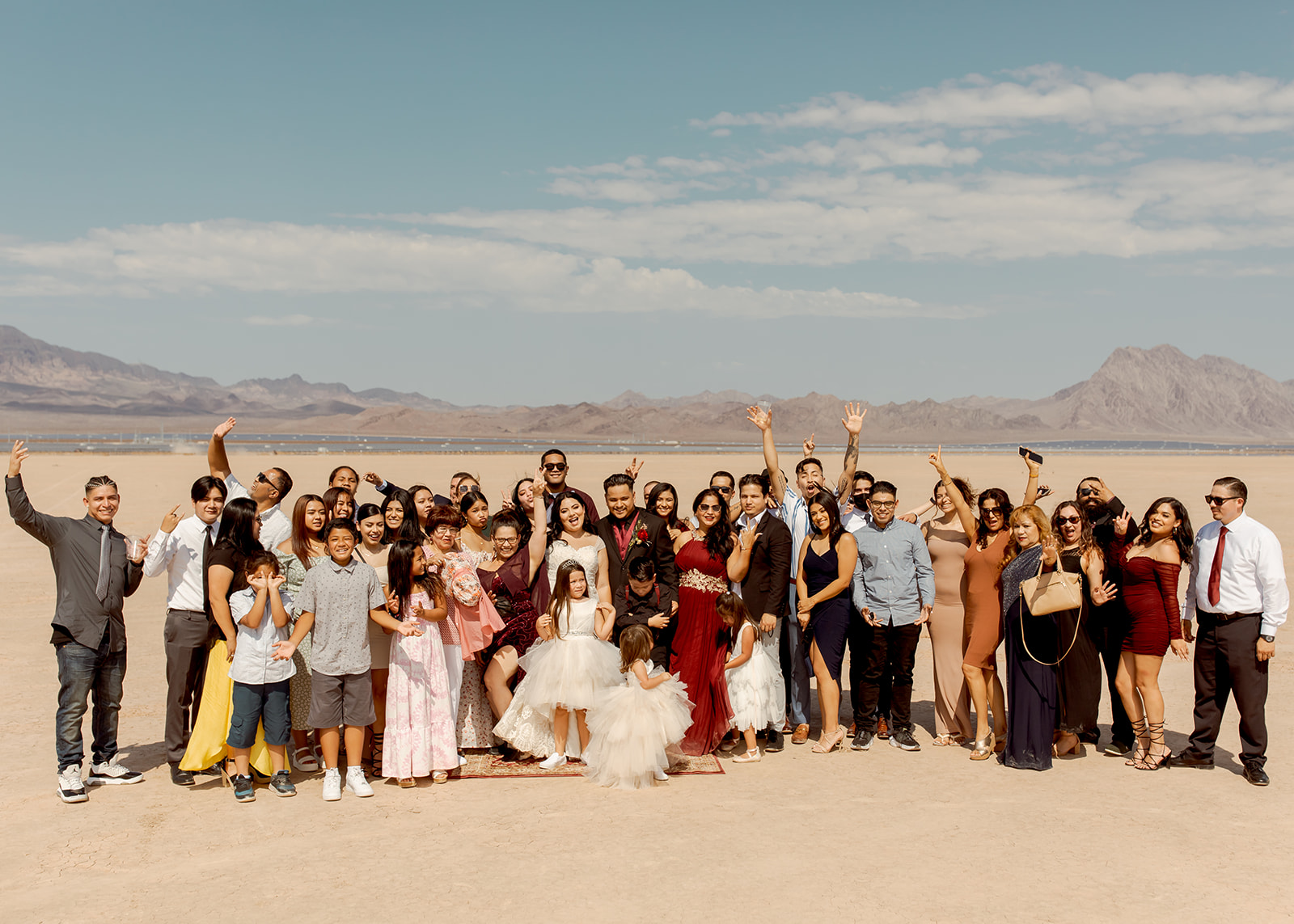 Group Cheering with Newlyweds after Moody Dry Lake Bed Elopement 