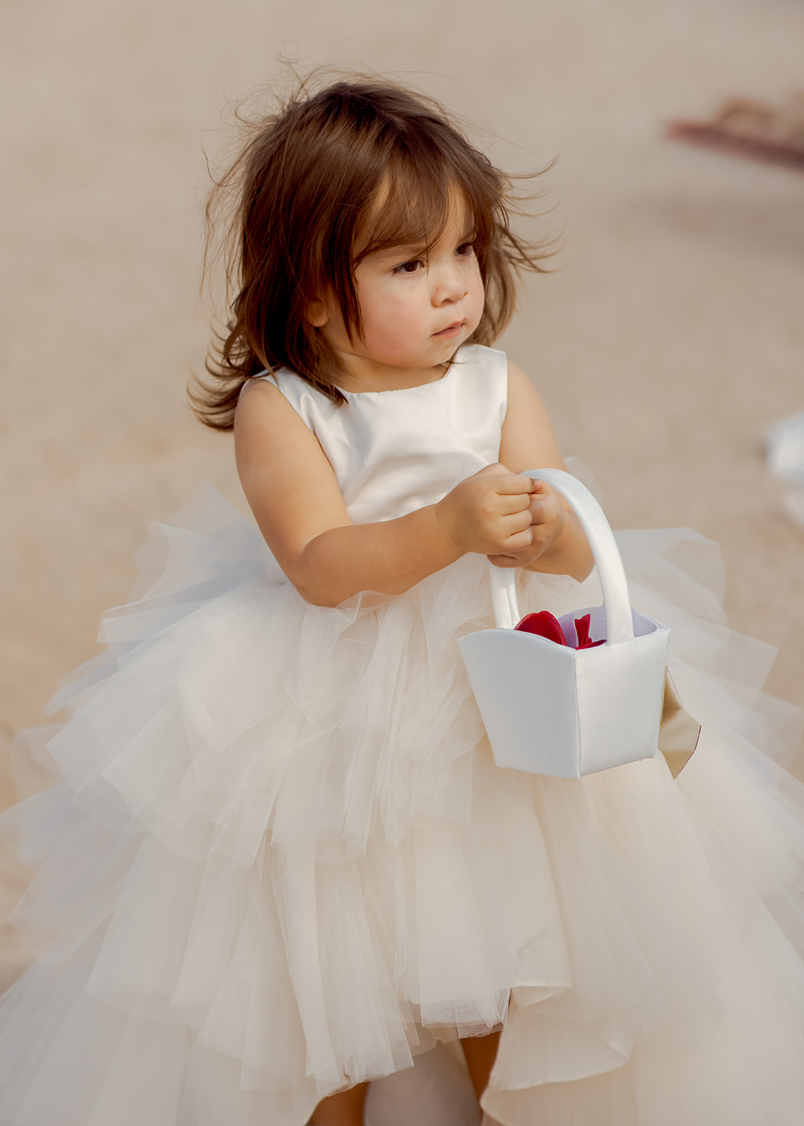 Flower Girl Holding Basket with Red Petals 