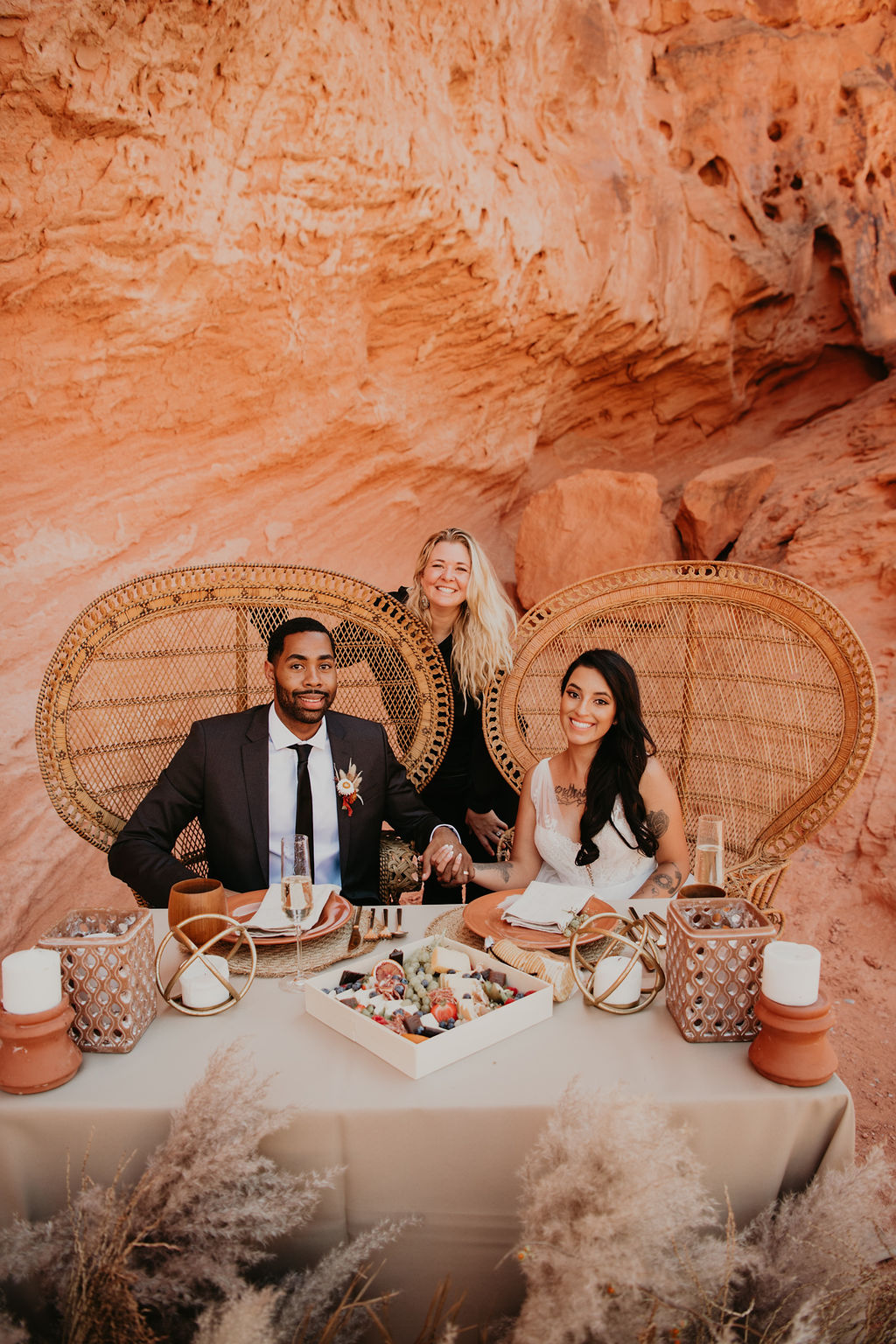 Las Vegas Wedding Planner with Couple at Designed White, Nude, Amber, & Beige Sweetheart Table at Valley of Fire 