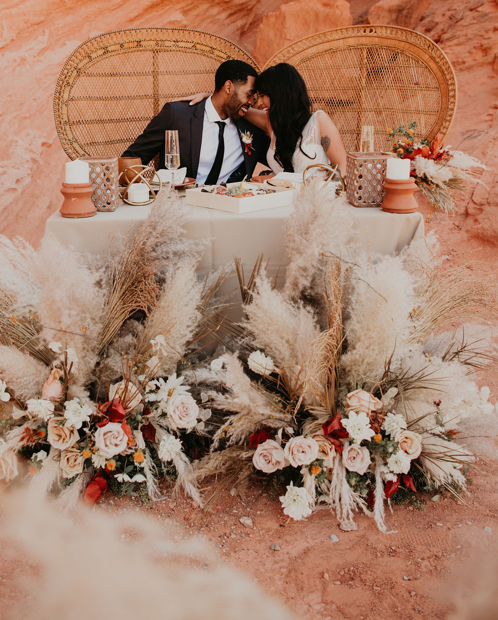 Couple Hugging and Laughing at Sweetheart Table in Valley of Fire 