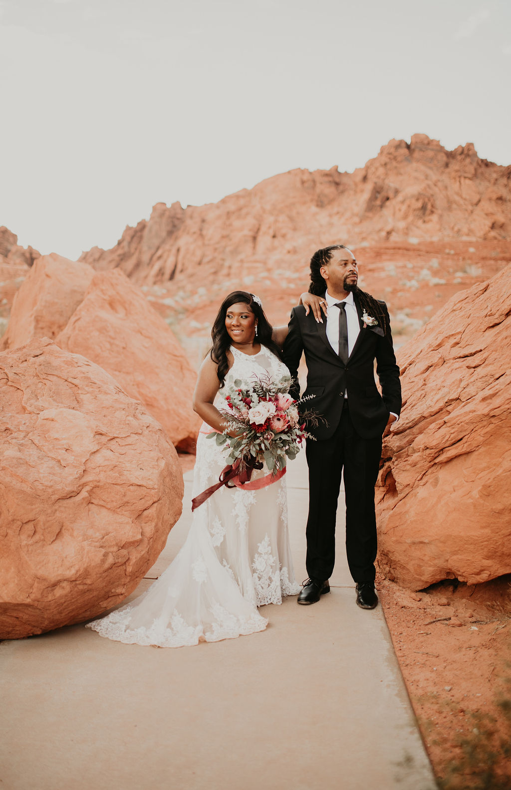 Bride and Groom Arrive in Valley of Fire for Rustic Pink Burgundy and Sage Elopement 