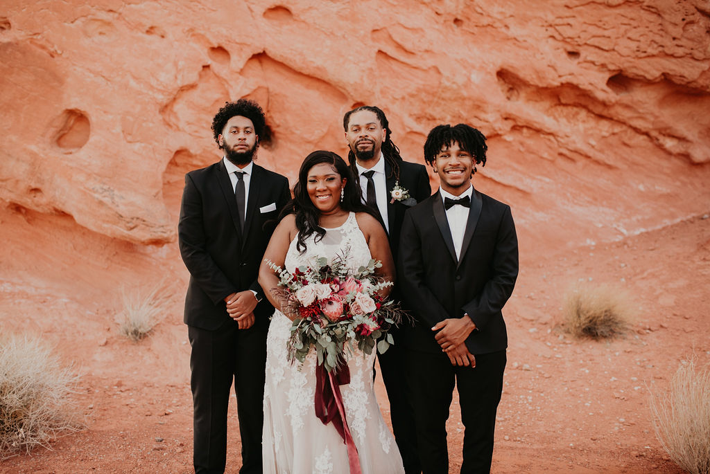 Bride & Groom with Sons during Rustic Pink Burgundy and Sage Elopement 