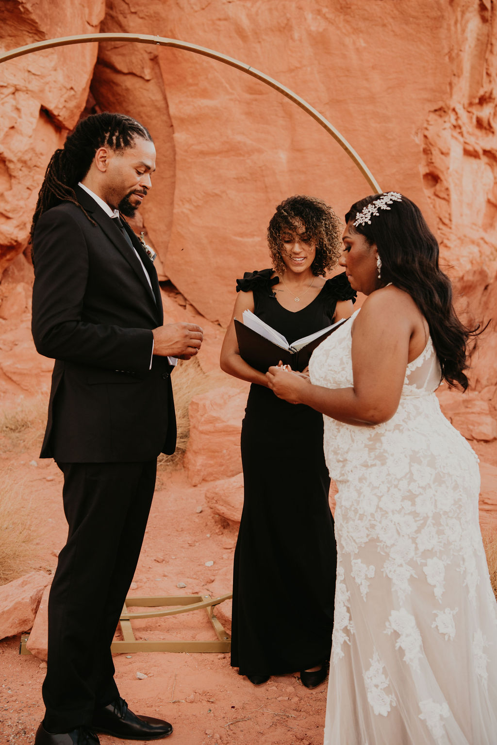 Bride Prepping to Put Ring on Groom during Valley of Fire Elopement 
