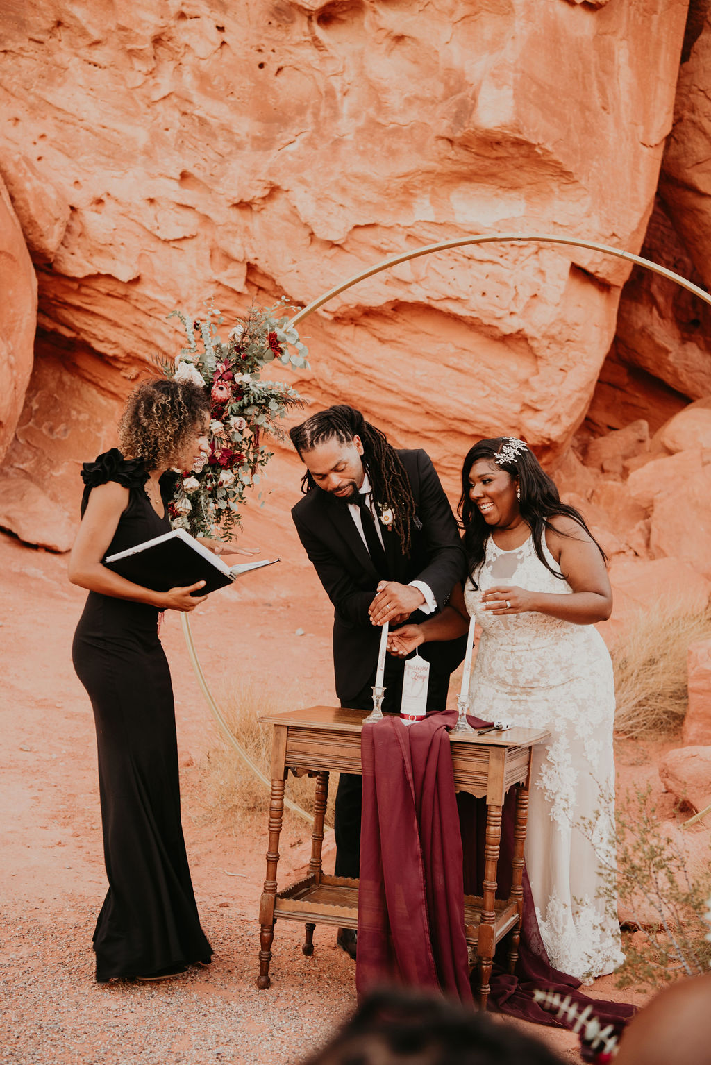 Groom Lighting Unity Candle during Valley of Fire Elopement Ceremony