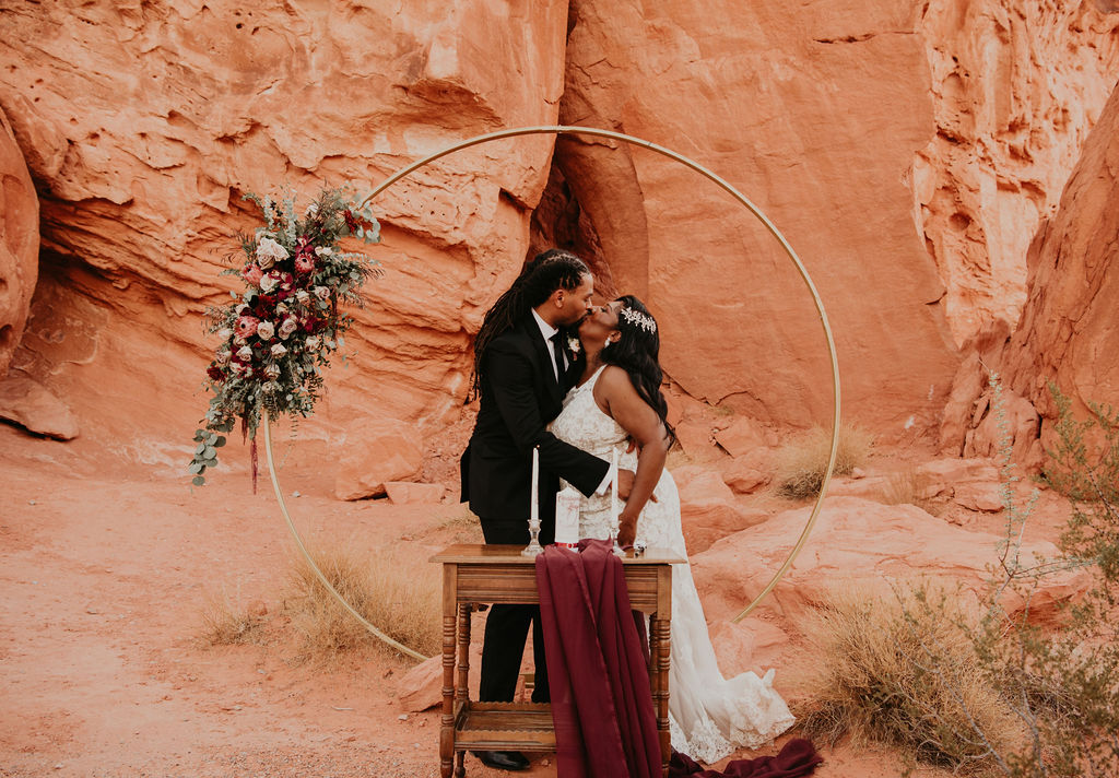 Newlyweds First Kiss for Rustic Pink Burgundy and Sage Elopement 