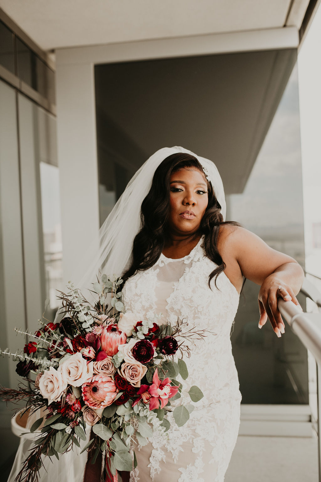 Bride on Balcony at The Cosmopolitan Las Vegas in Rustic Pink Burgundy and Sage Elopement 