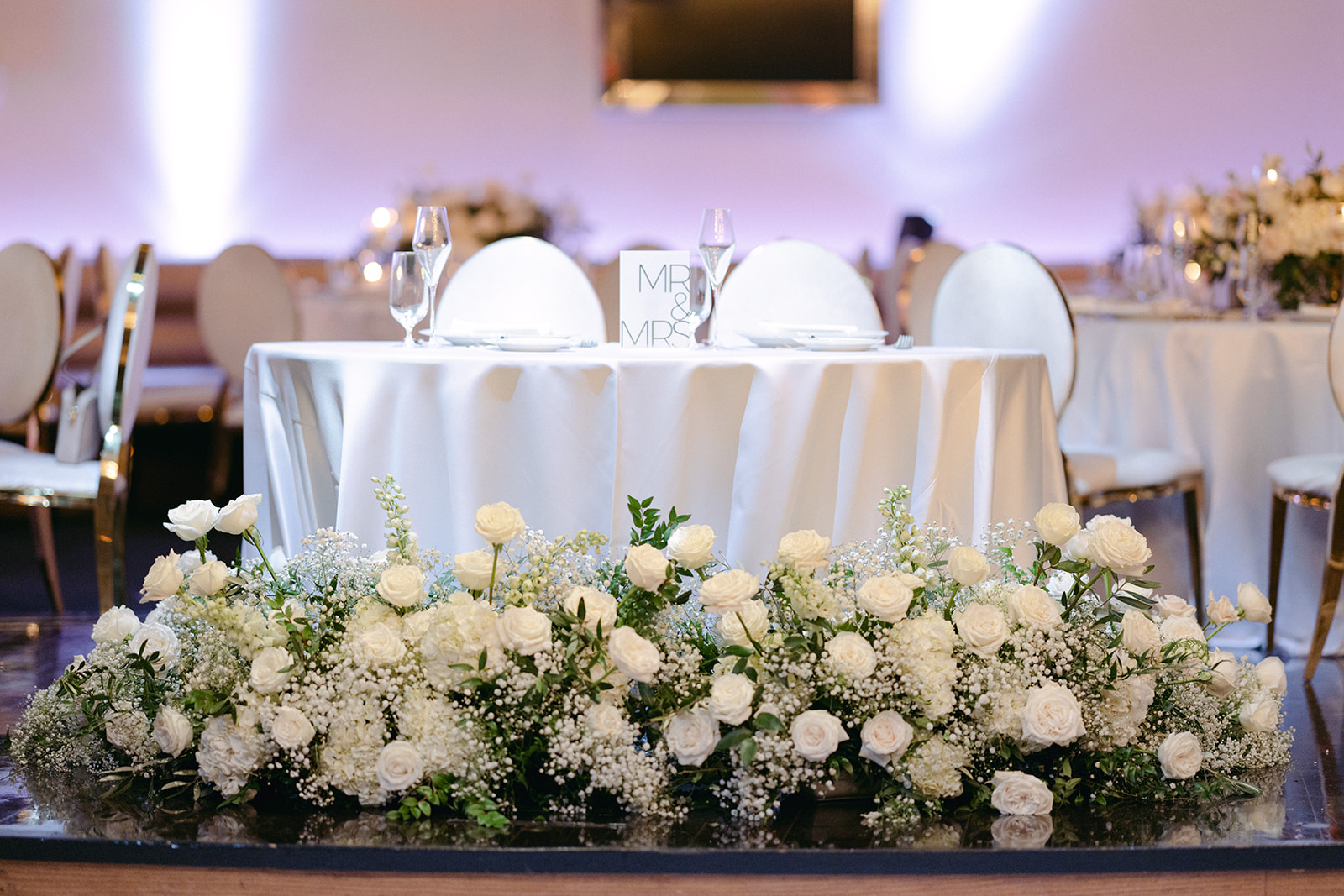Sweetheart Table with white roses and baby's breath 