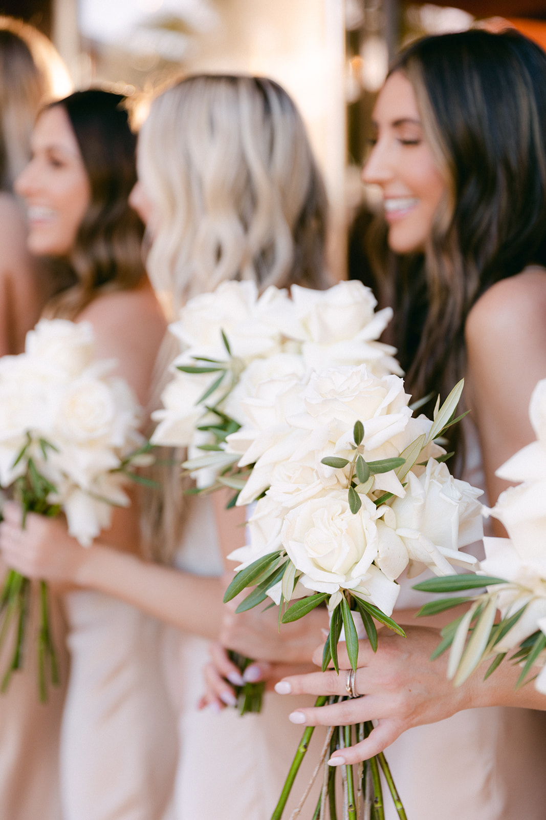 Bridesmaids with white rose bouquets 