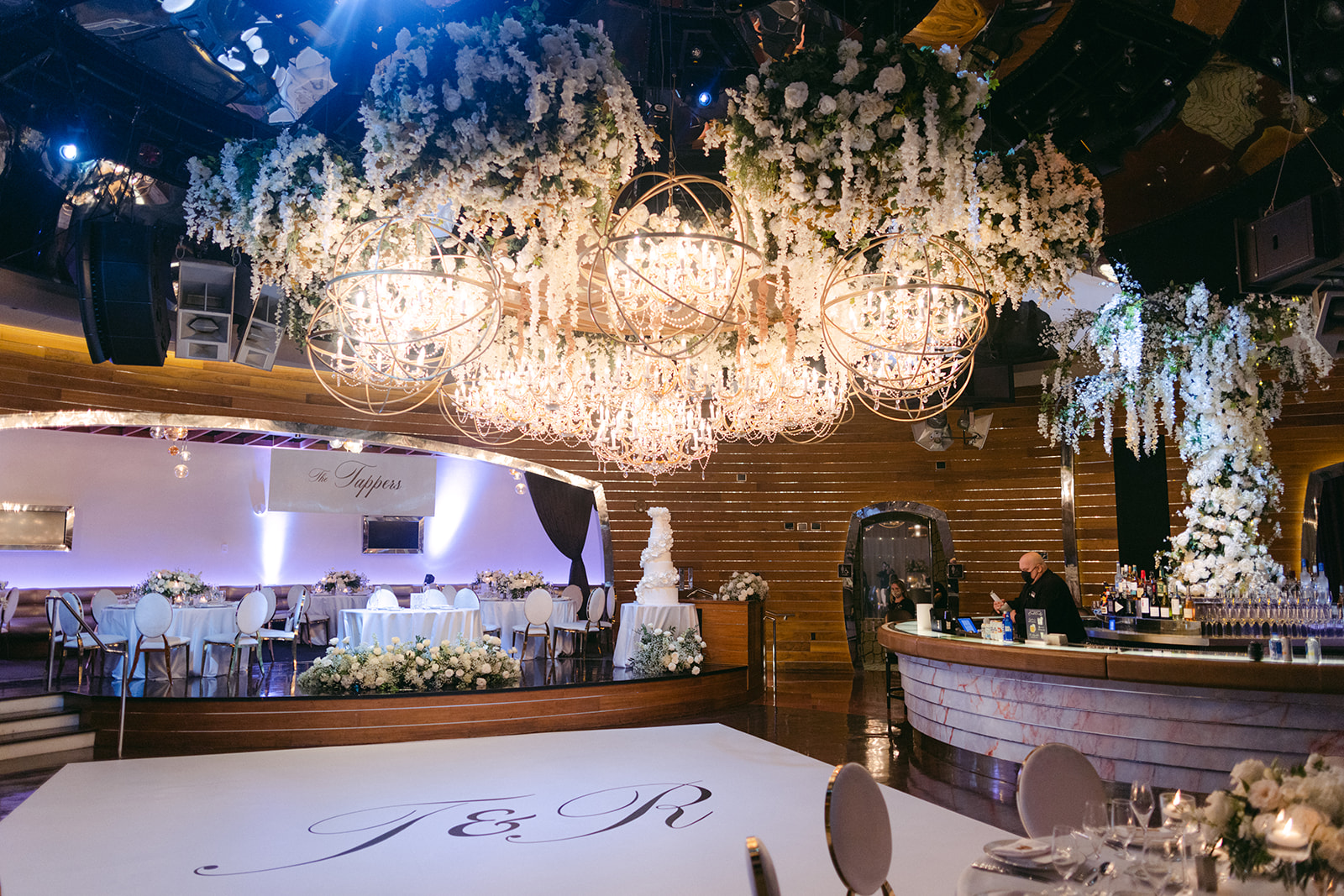 Dramatic chandelier and floral hanging installations for Red Rock Casino Timeless Modern Wedding 