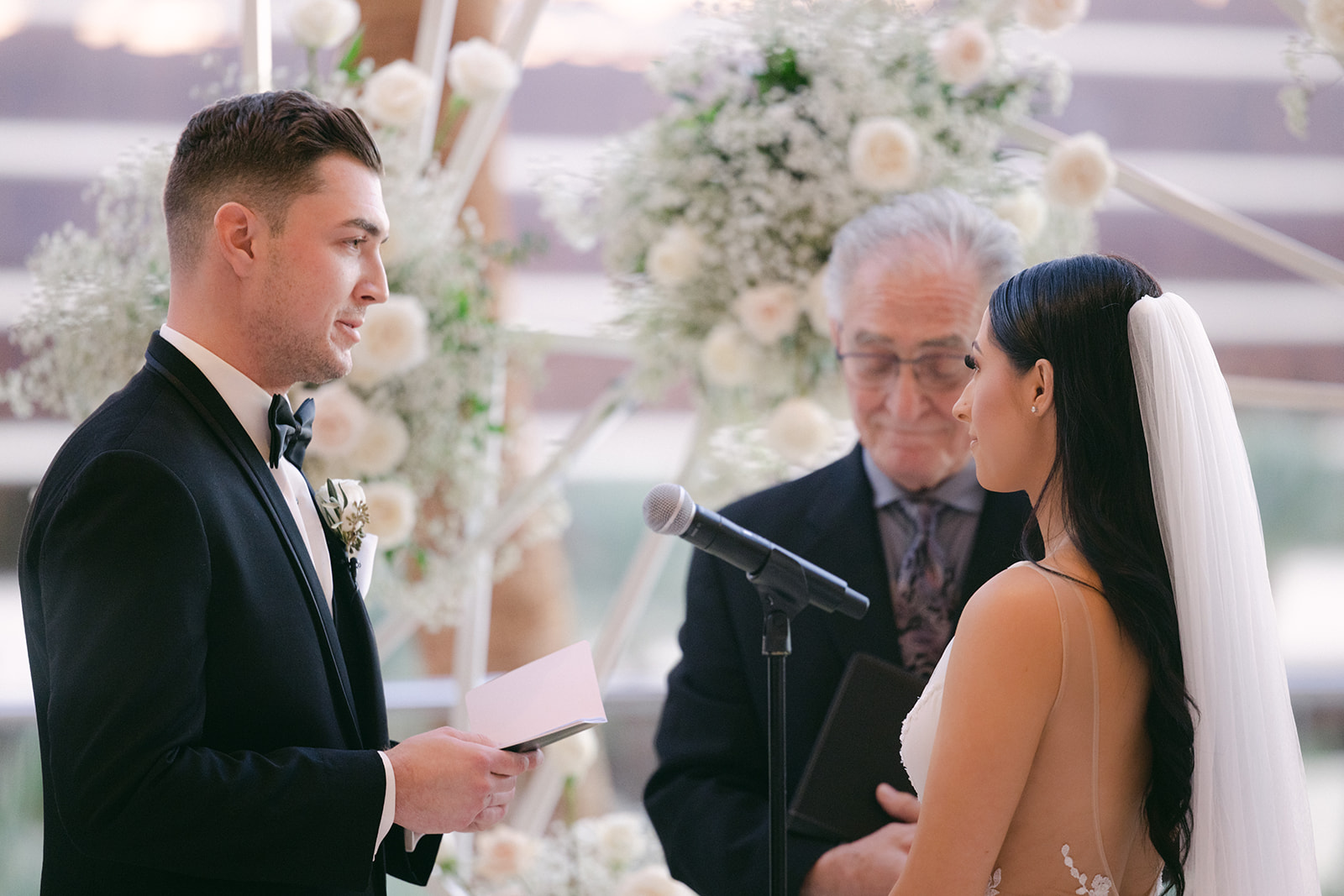 Groom giving personal vows during ceremony 