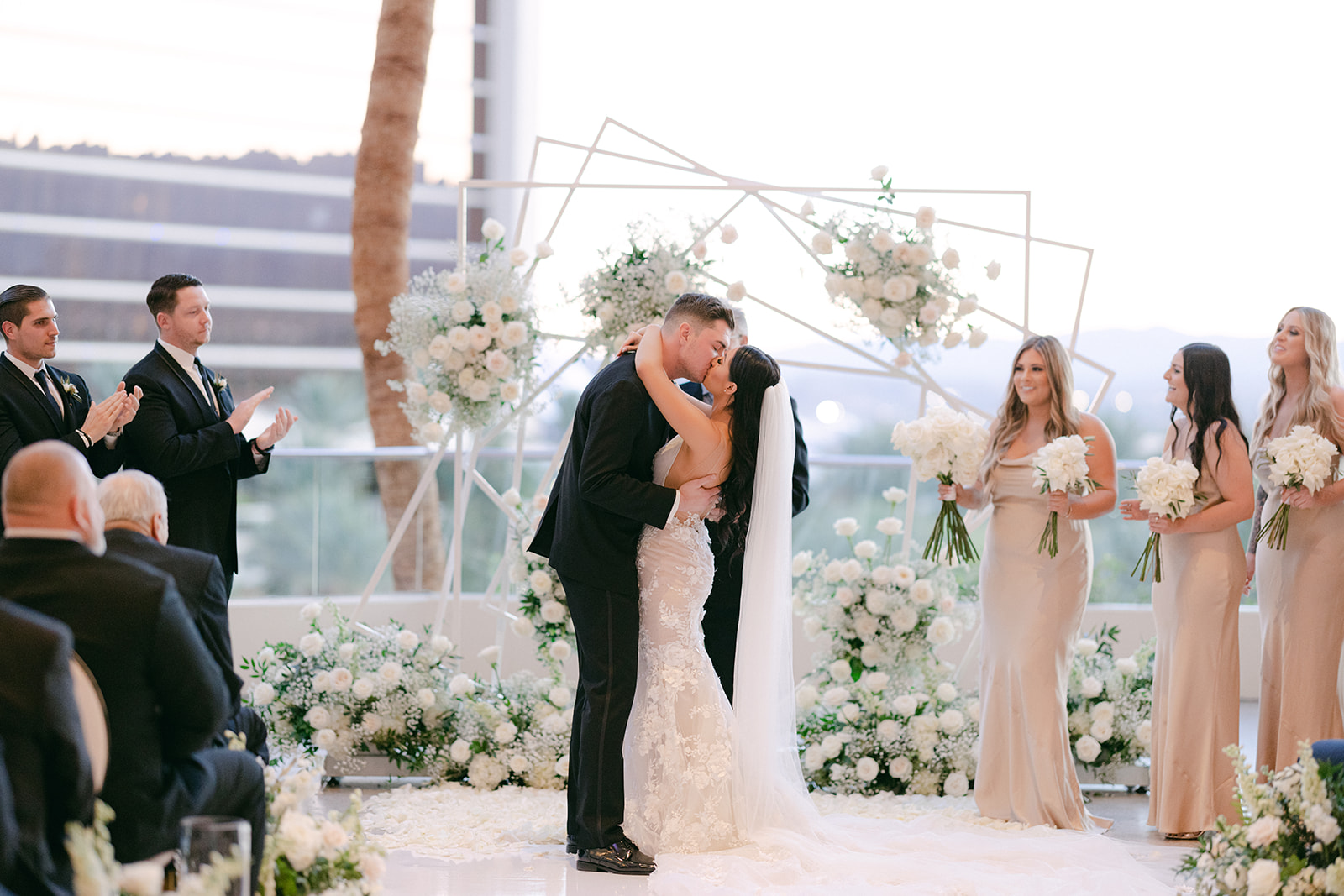 Newlyweds first kiss for Red Rock Casino Timeless Modern Wedding 