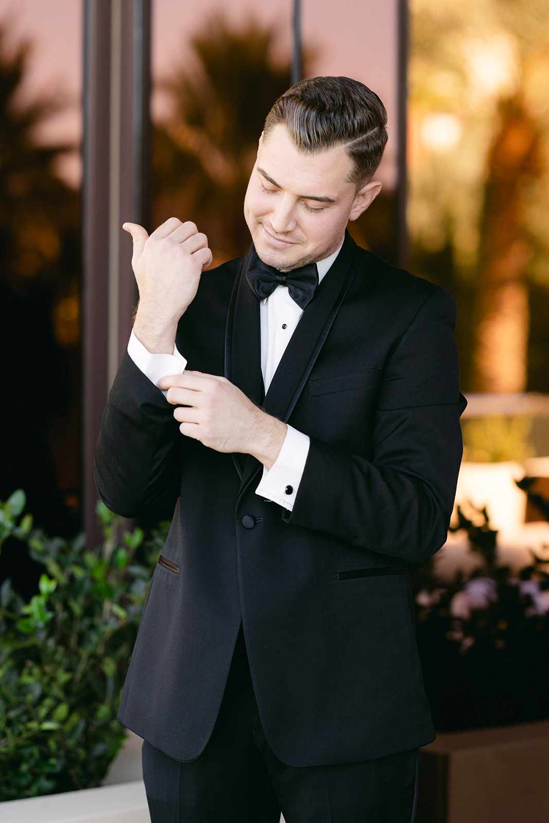 Groom in all black suit who bow tie for Red Rock Casino Timeless Modern Wedding 