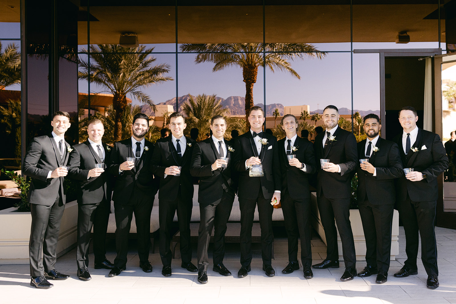 Groomsmen together for photo before groom does first look with the bride 