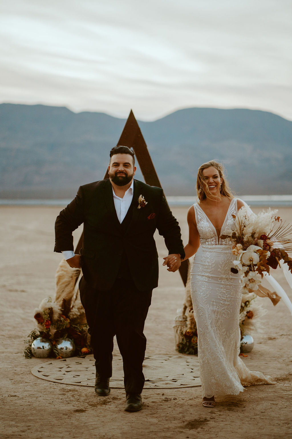 Newlyweds Exiting Ceremony on Las Vegas Dry Lake Bed 