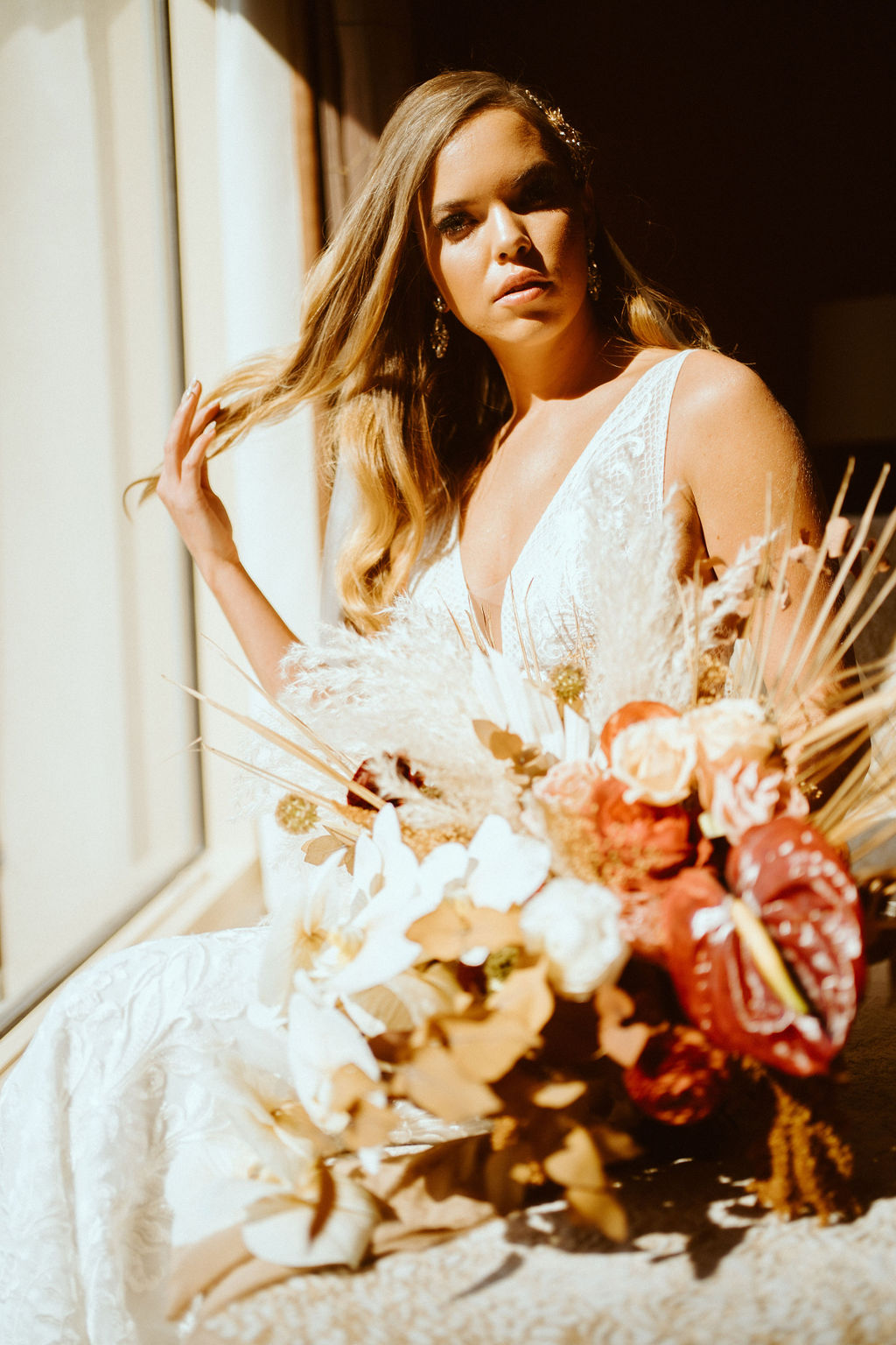 Bride Sitting with Bouquet in Sunlight in Las Vegas While Getting Ready 