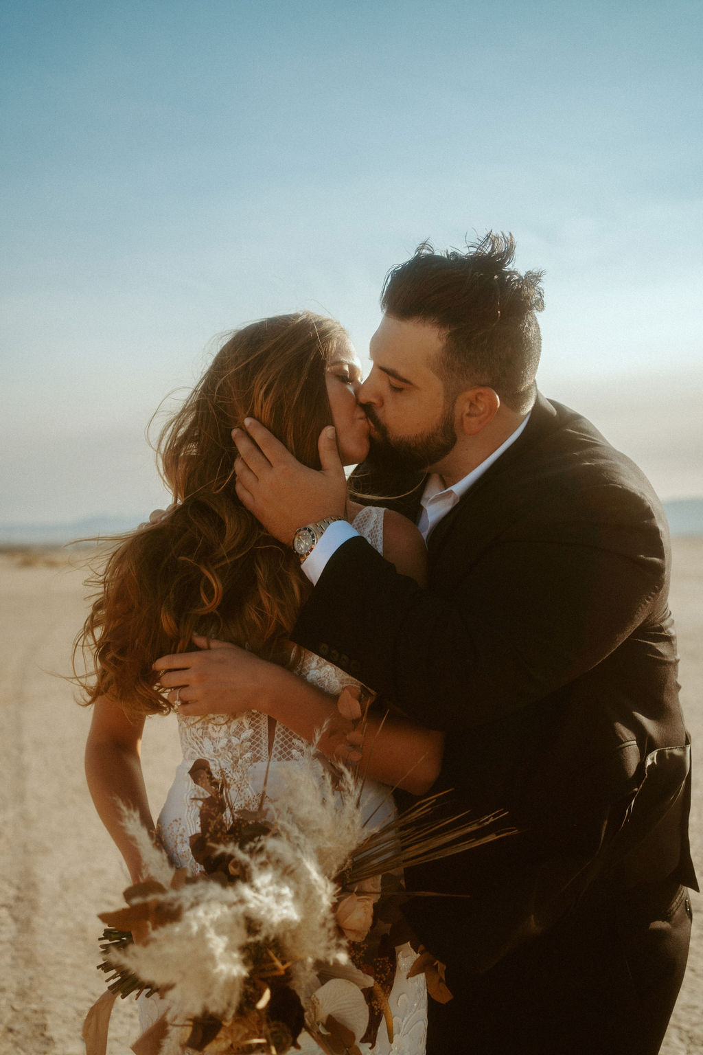 Bride and Groom Kissing in Desert 