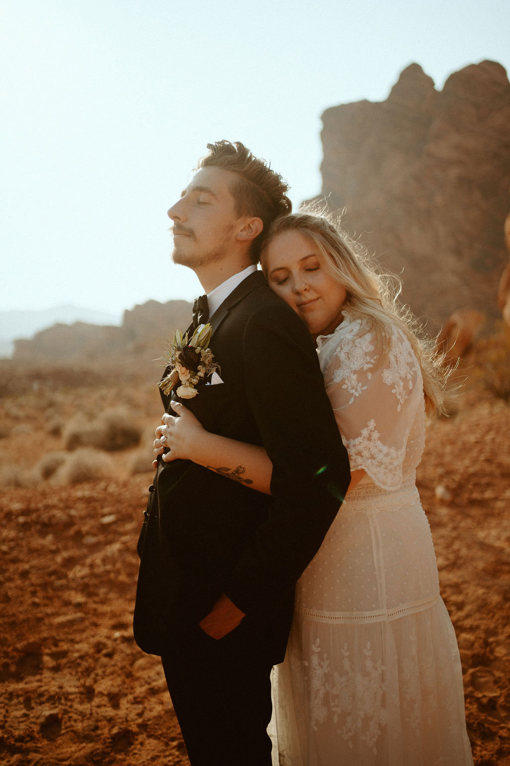 Bride Hugging Groom in Desert Near Las Vegas after Getting Married 