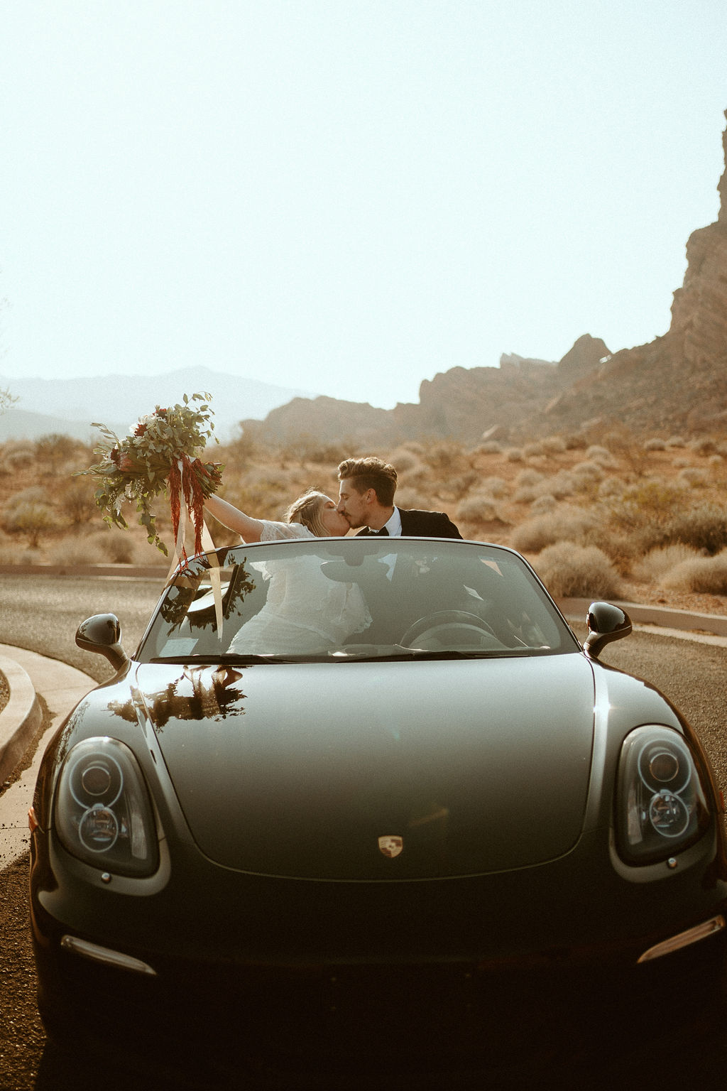 Couple Leaving the Desert in Porsche after Eloping near Las Vegas 