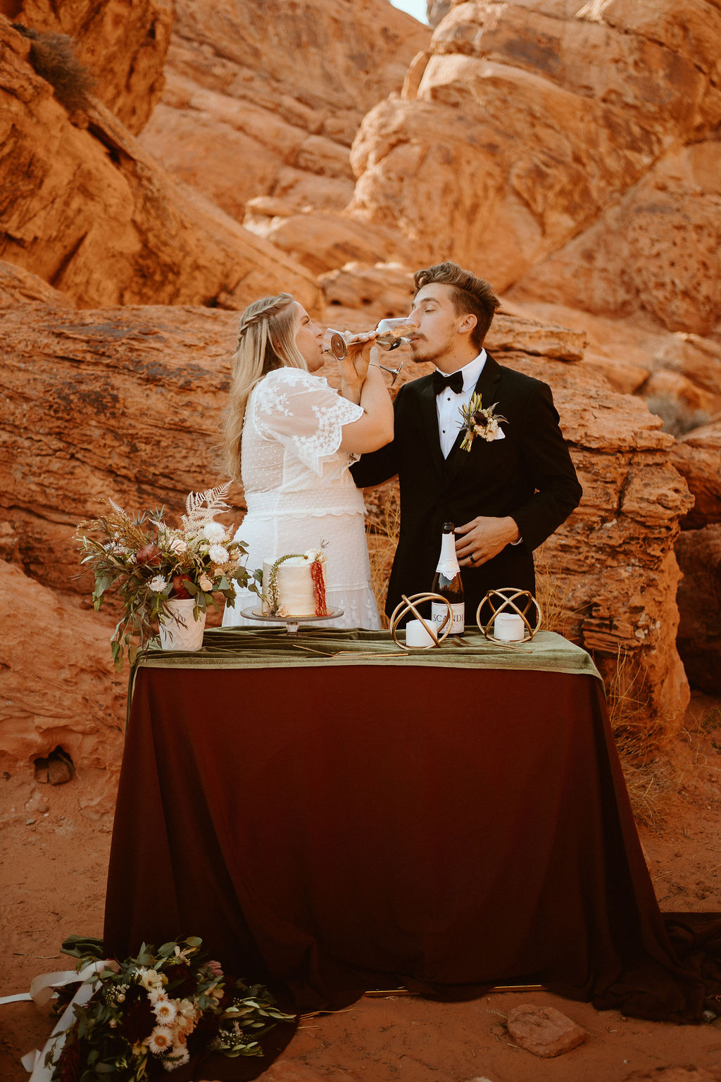 Bride & Groom Sipping Champagne in Desert Elopement Near Las Vegas 