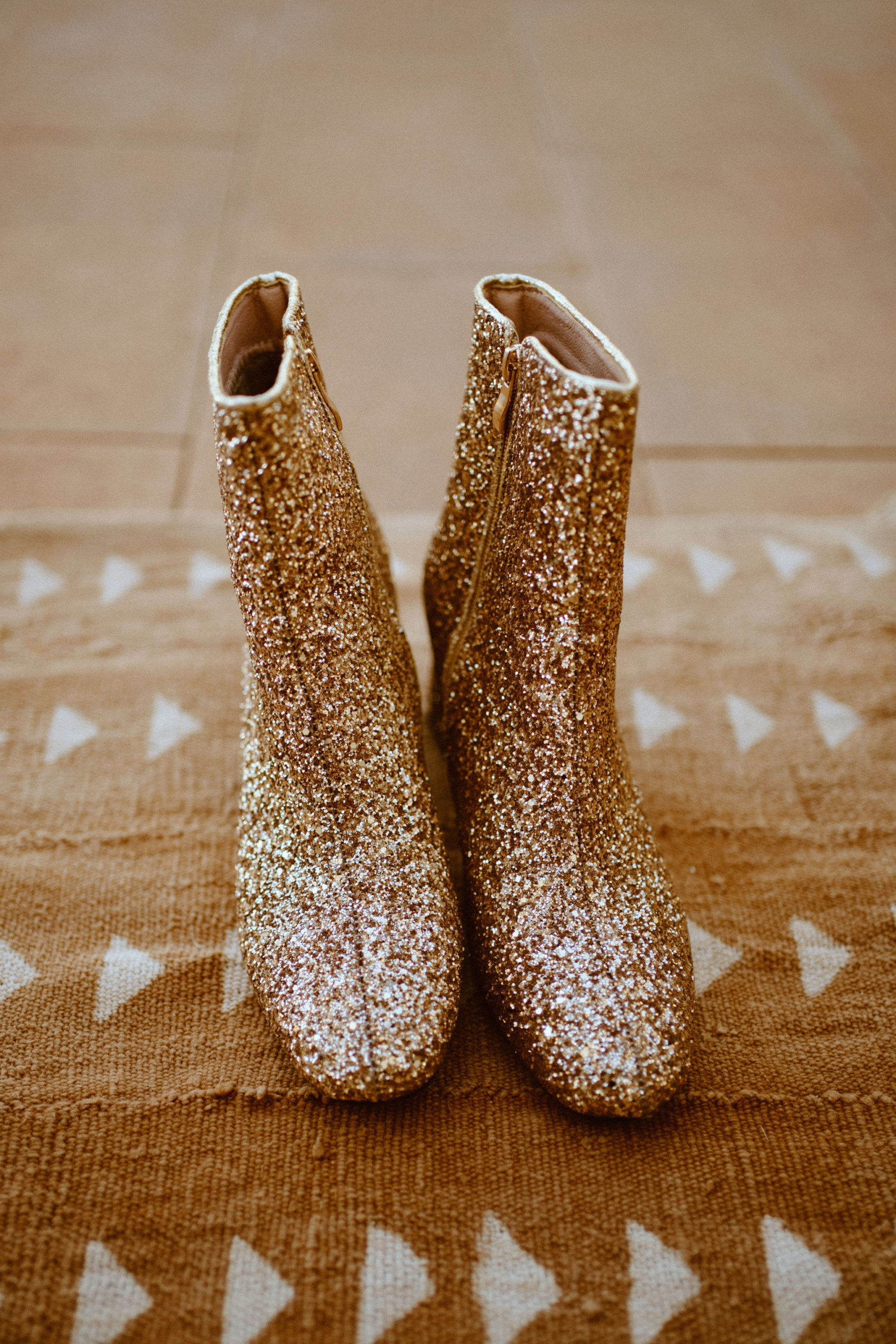 The brides gold sparkly cowboy boots