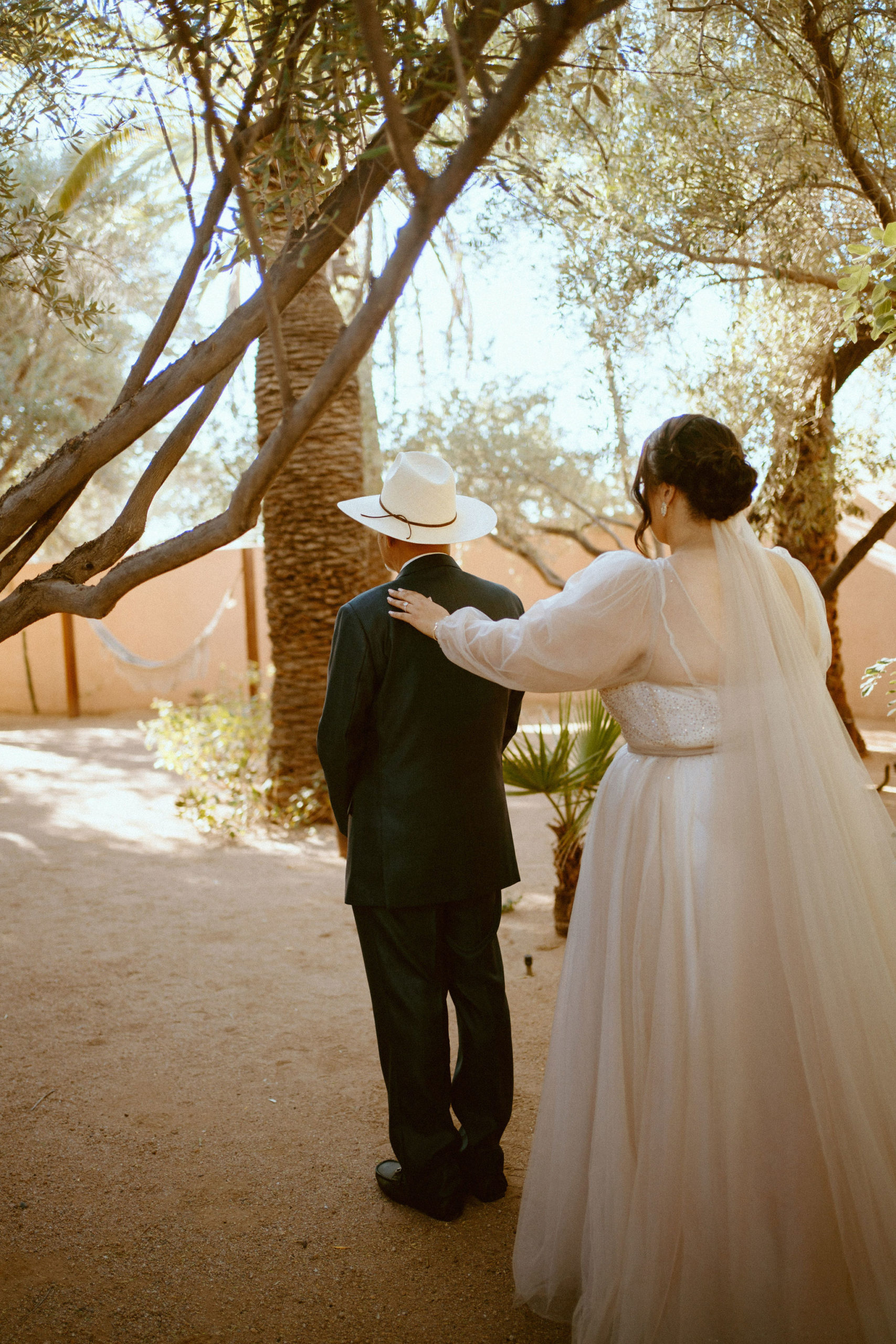 Saguaro National Park Micro-Wedding. The bride tapping on her dads shoulder for the first look