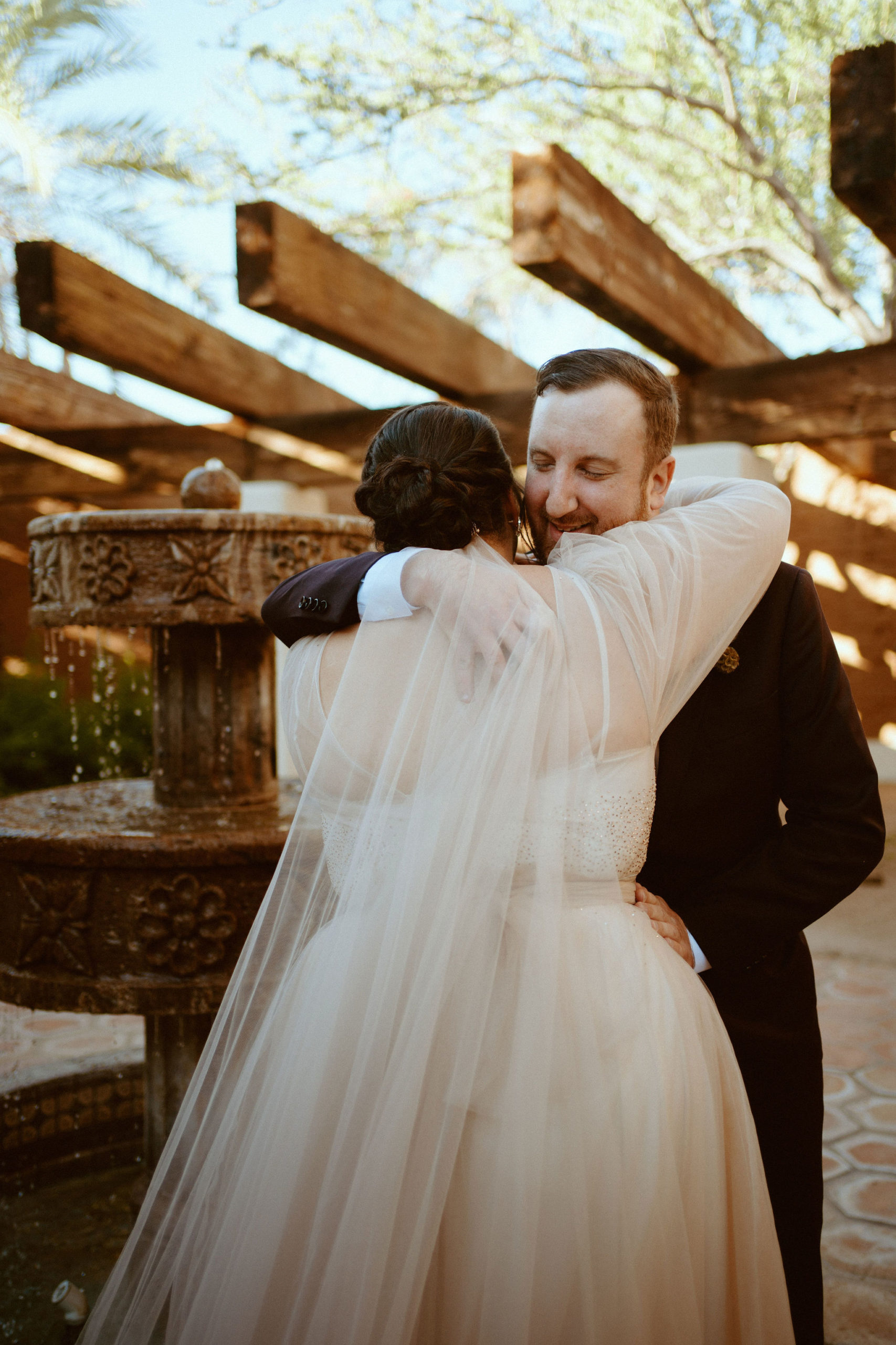 Saguaro National Park Micro-Wedding. The bride and groom hug as they see each other for the first time 