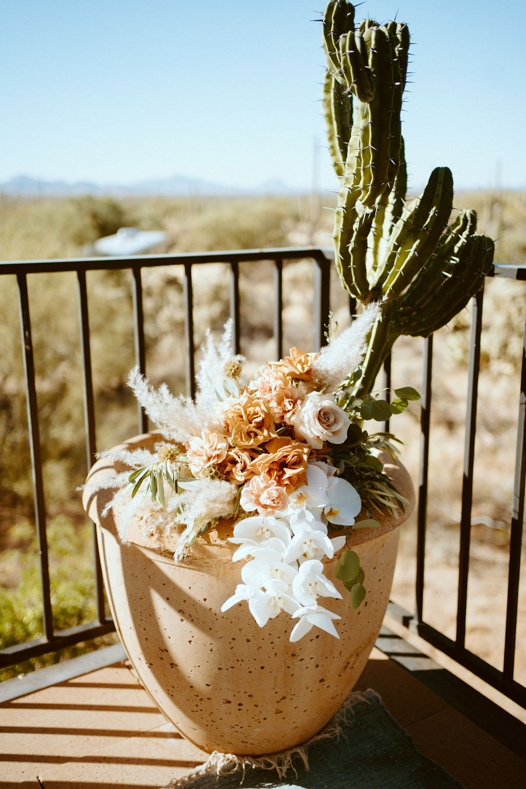 Bridal bouquet on a pot with cactuses 