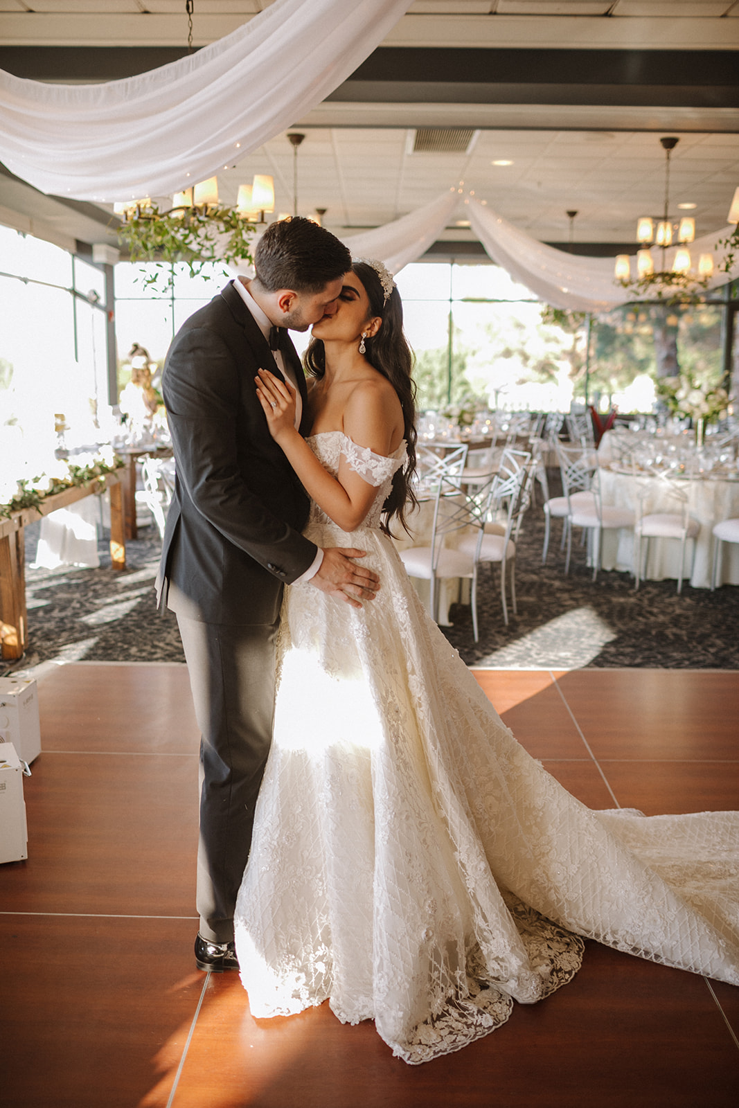 Newlywed Kissing on Dance floor during Room Reveal for Fairytale Revere Country Club Wedding