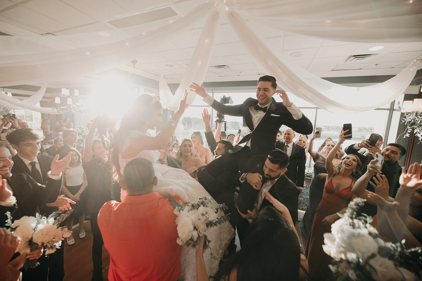 Newlyweds Lifted into Air to Start Reception 