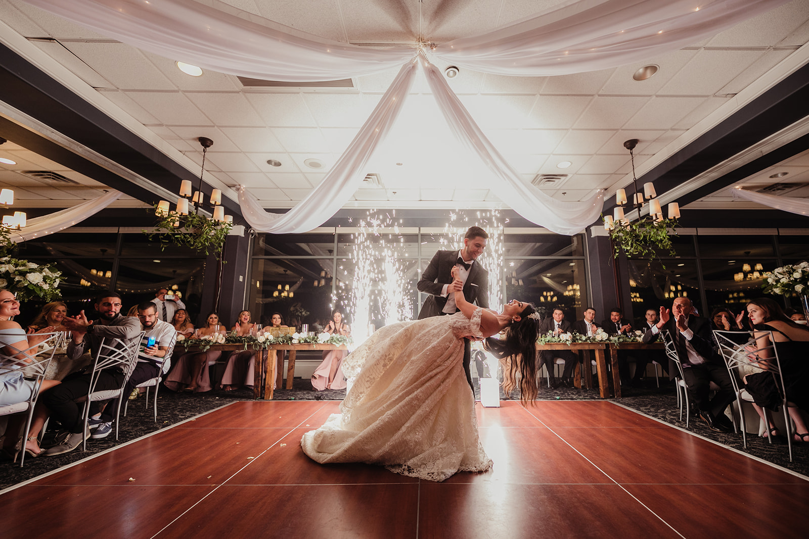 Newlyweds Dancing for First Dance with Indoor Sparkler in Background for Fairytale Revere Country Club Wedding