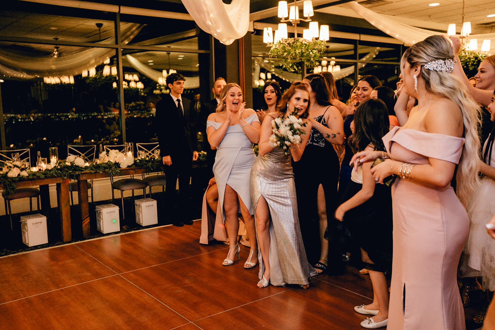 Guests Catching Bouquet during Wedding Reception 