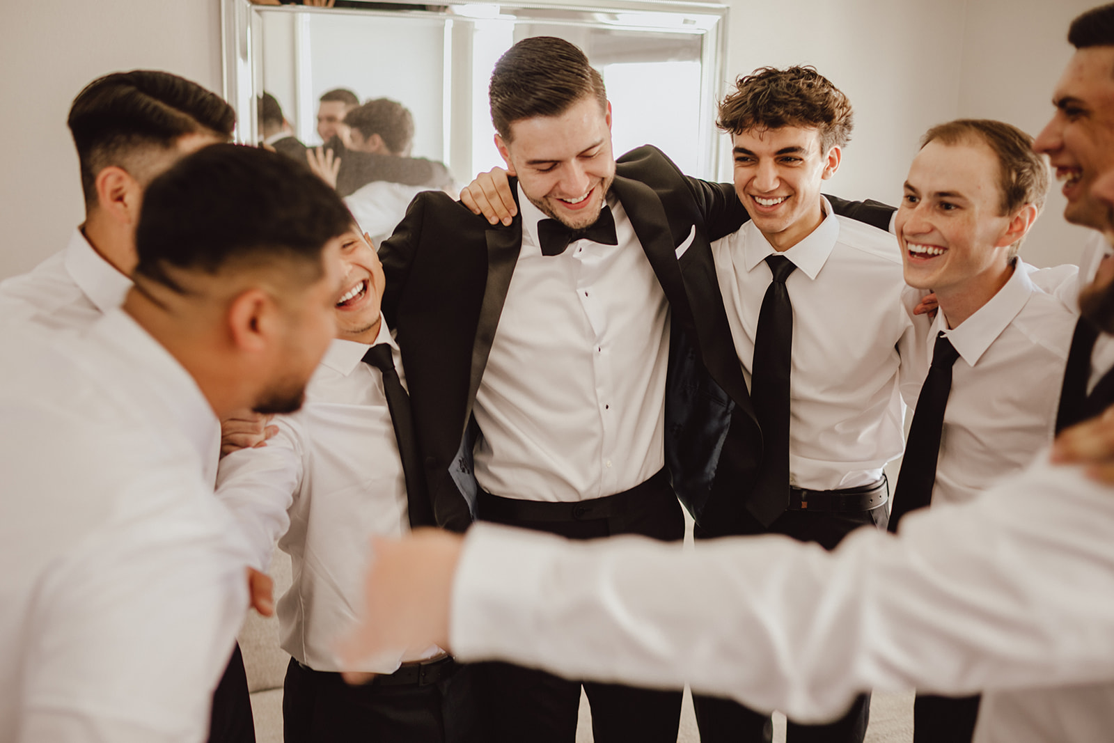 Groom with his Groomsmen in Circle before Wedding Ceremony 