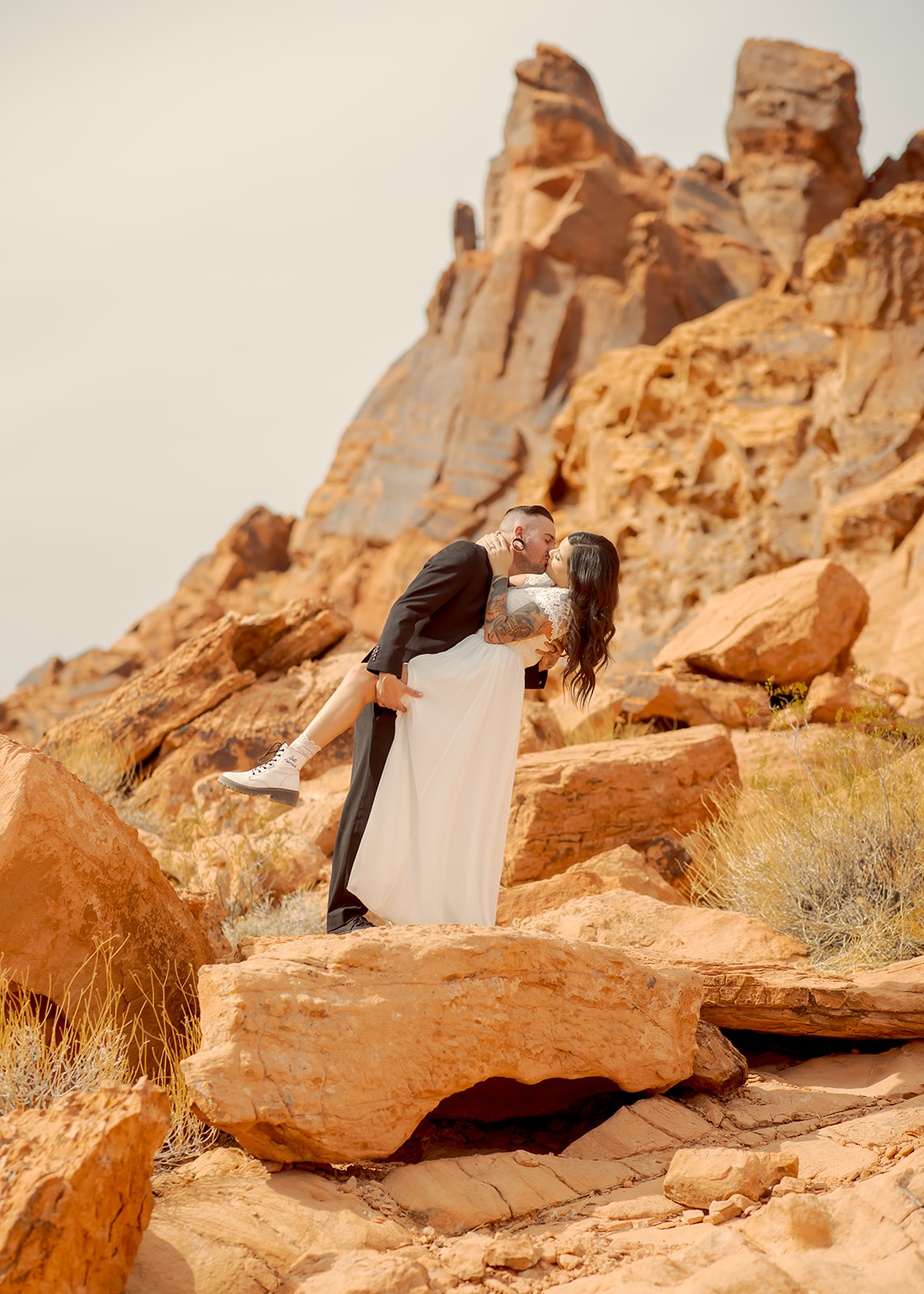Newlyweds Kissing on Dramatic Red Rocks at Valley of Fire near Las Vegas 