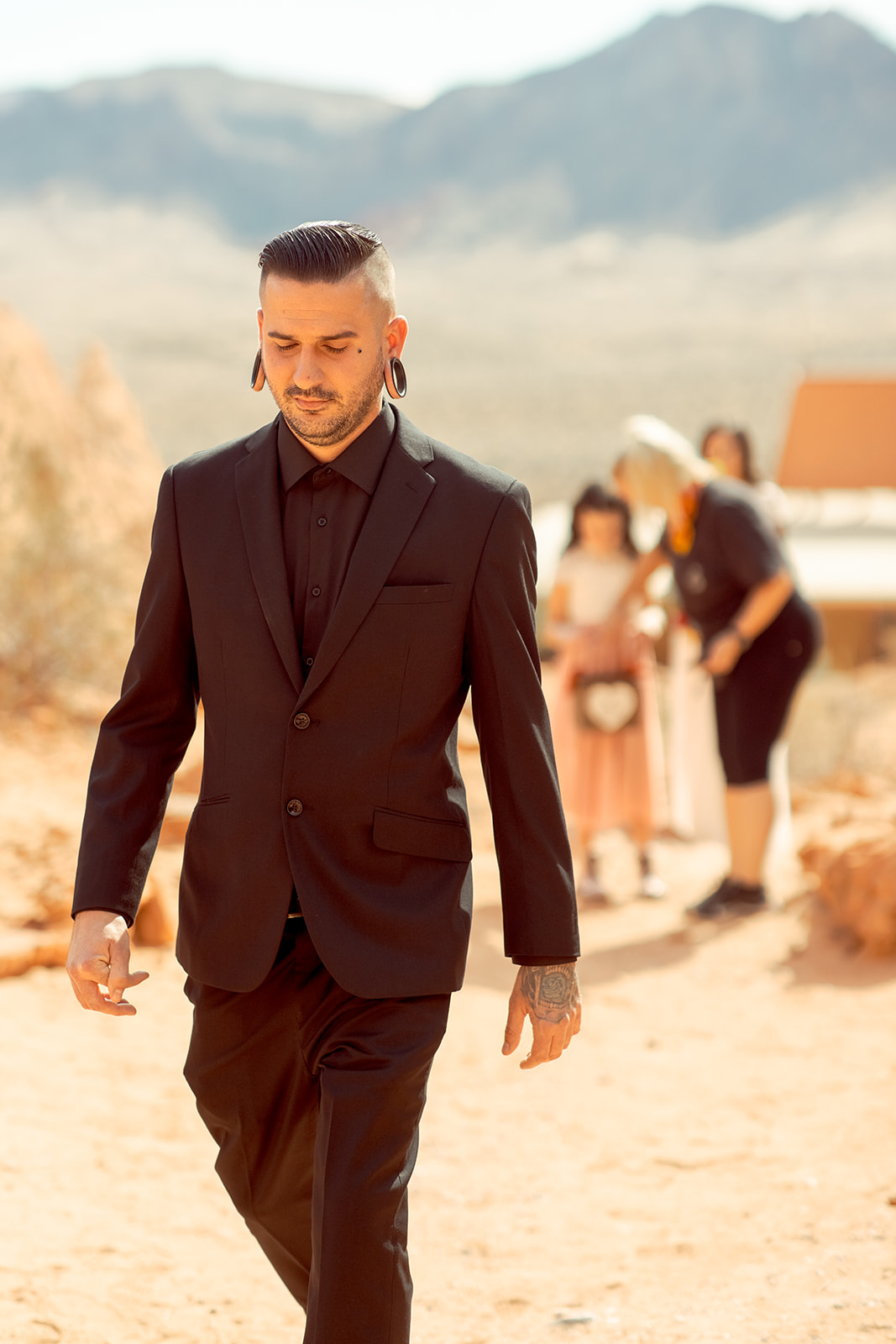 Groom in All Black walking to Altar at Valley of Fire Rock N Roll Wedding