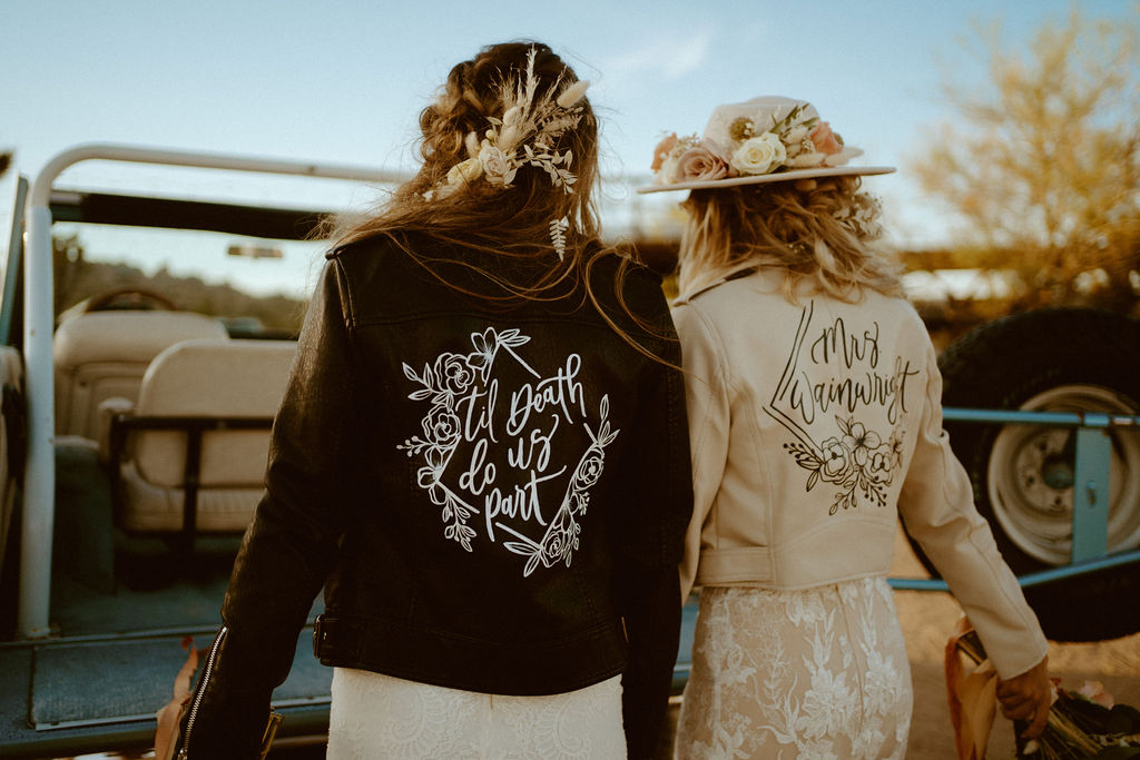 brides in custom leather jackets 