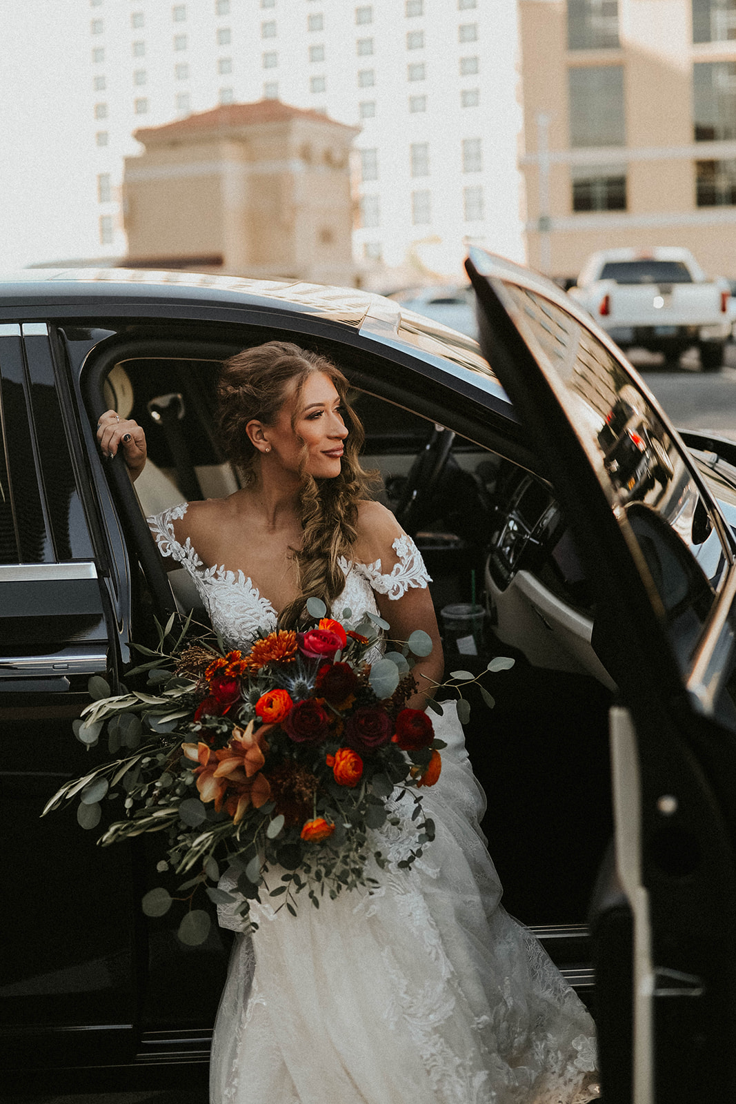 Bride getting in car leaving for ceremony