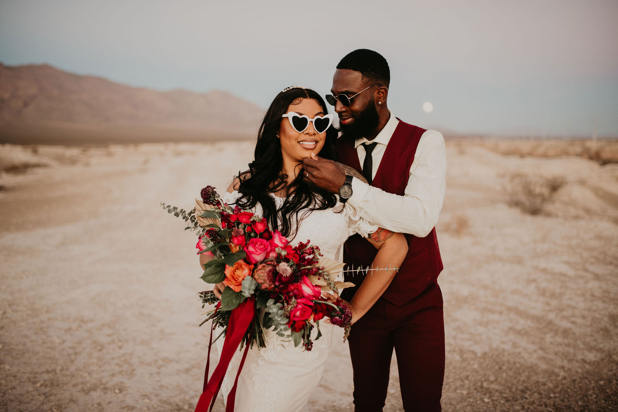 Bride and Groom in Sunglasses in desert 
