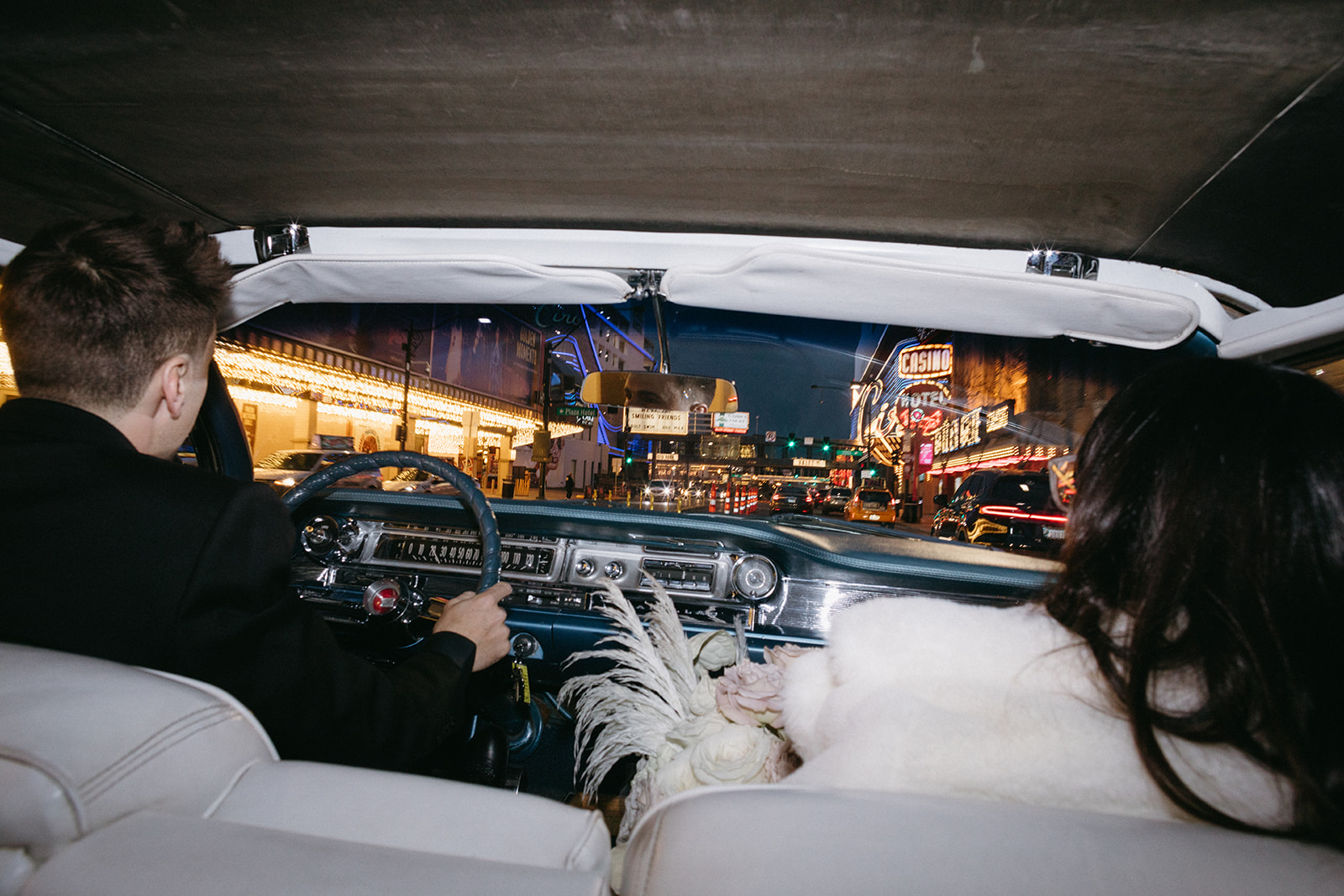 View from the Backseat while Bride & Groom Drive in Downtown Las Vegas  in Classic Car 