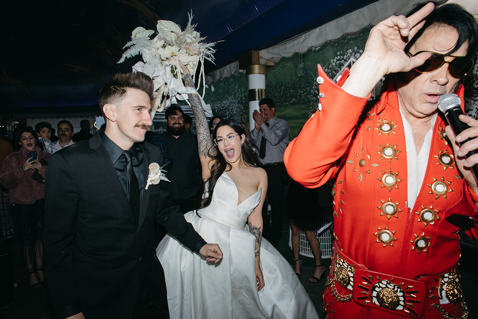 Bride with Romantic White Bouquet Elvis in Red Suite at Little White Wedding Chapel Modern Vegas Wedding