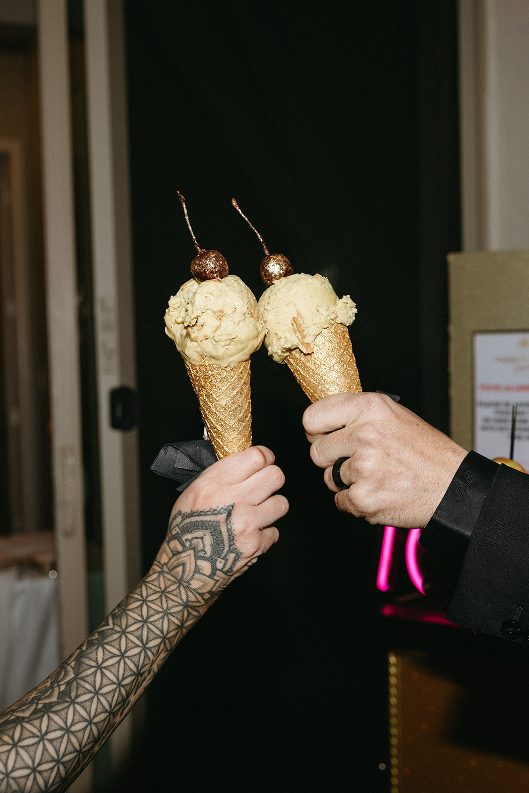 Bride and Groom doing a Cheers with their Ice Cream Cone Desserts during Little White Wedding Chapel Modern Vegas Wedding Reception 