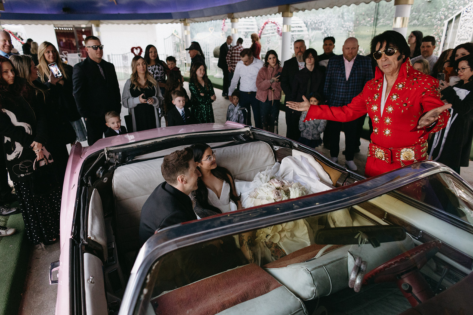 Couple getting Married in Pink Cadillac by Elvis 