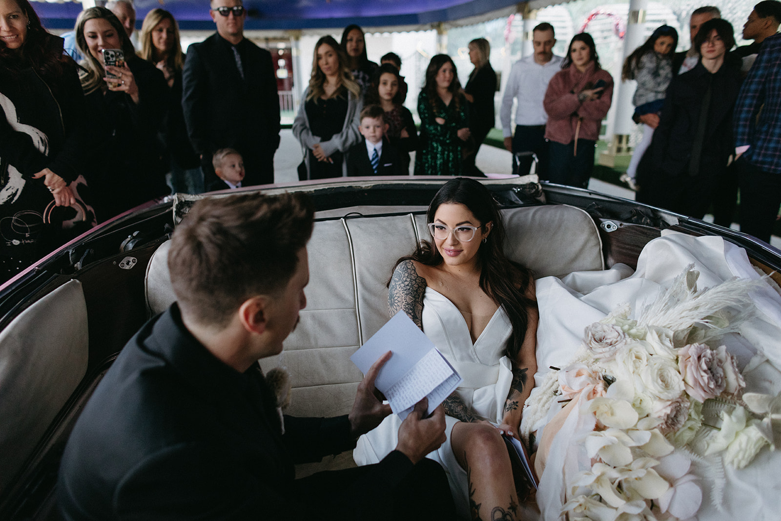 Groom reading Vows to Bride during Little White Wedding Chapel Modern Vegas Wedding