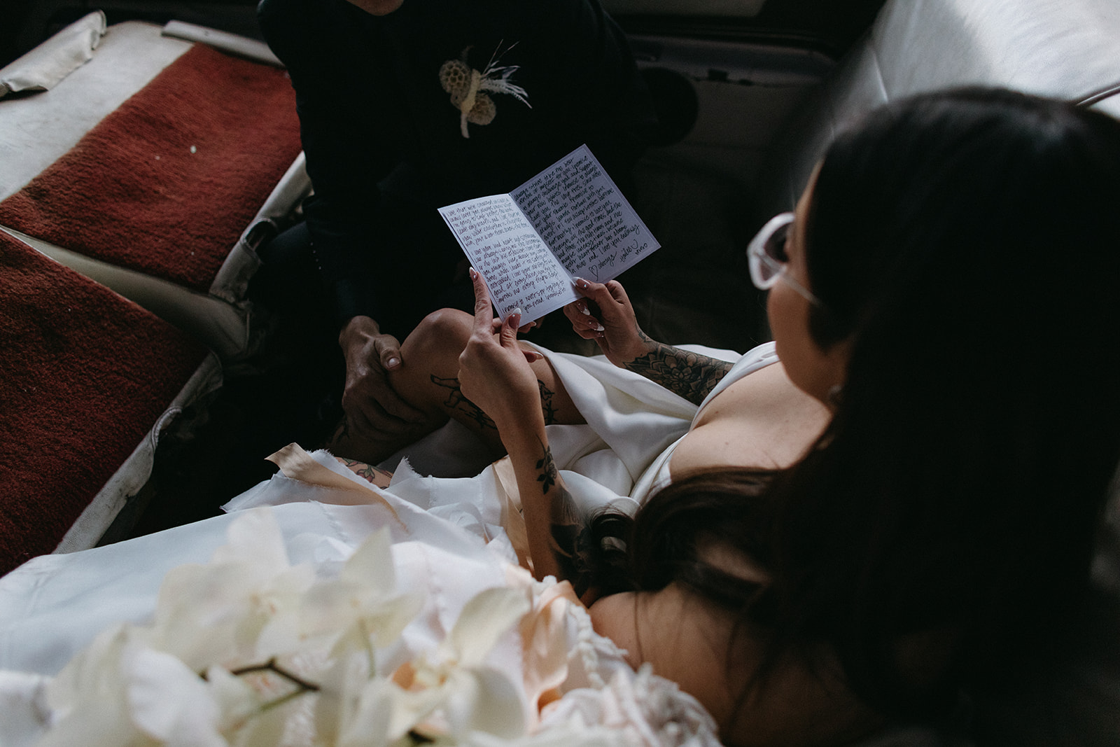 Bride reading Groom Vows out of Vow Book during Little White Wedding Chapel Modern Vegas Wedding
