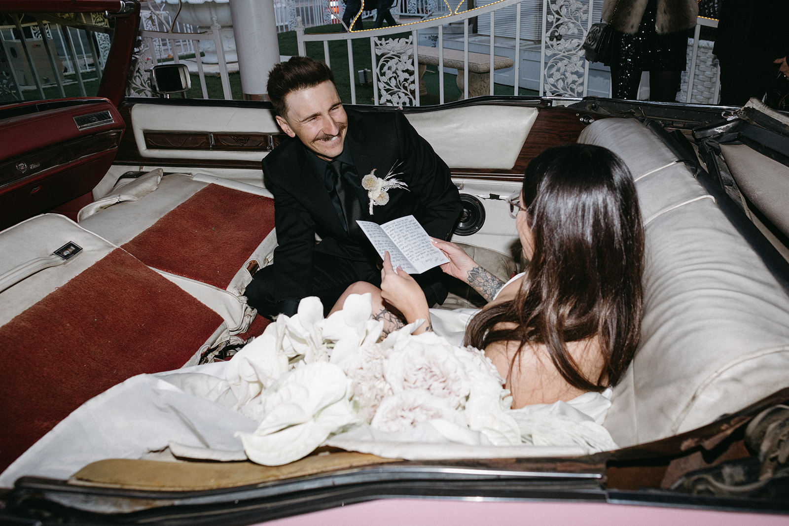 Groom smiling while bride reads vows in Las Vegas Chapel Wedding 