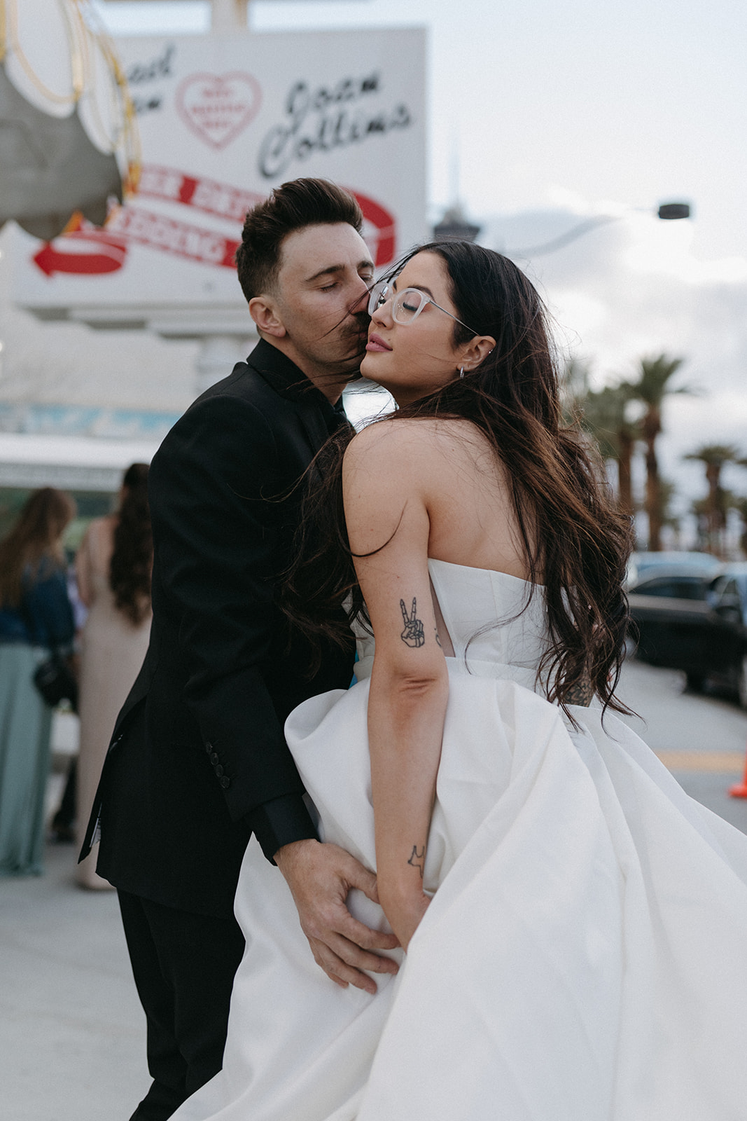 Grooming Kissing Bride on Cheek in Las Vegas 