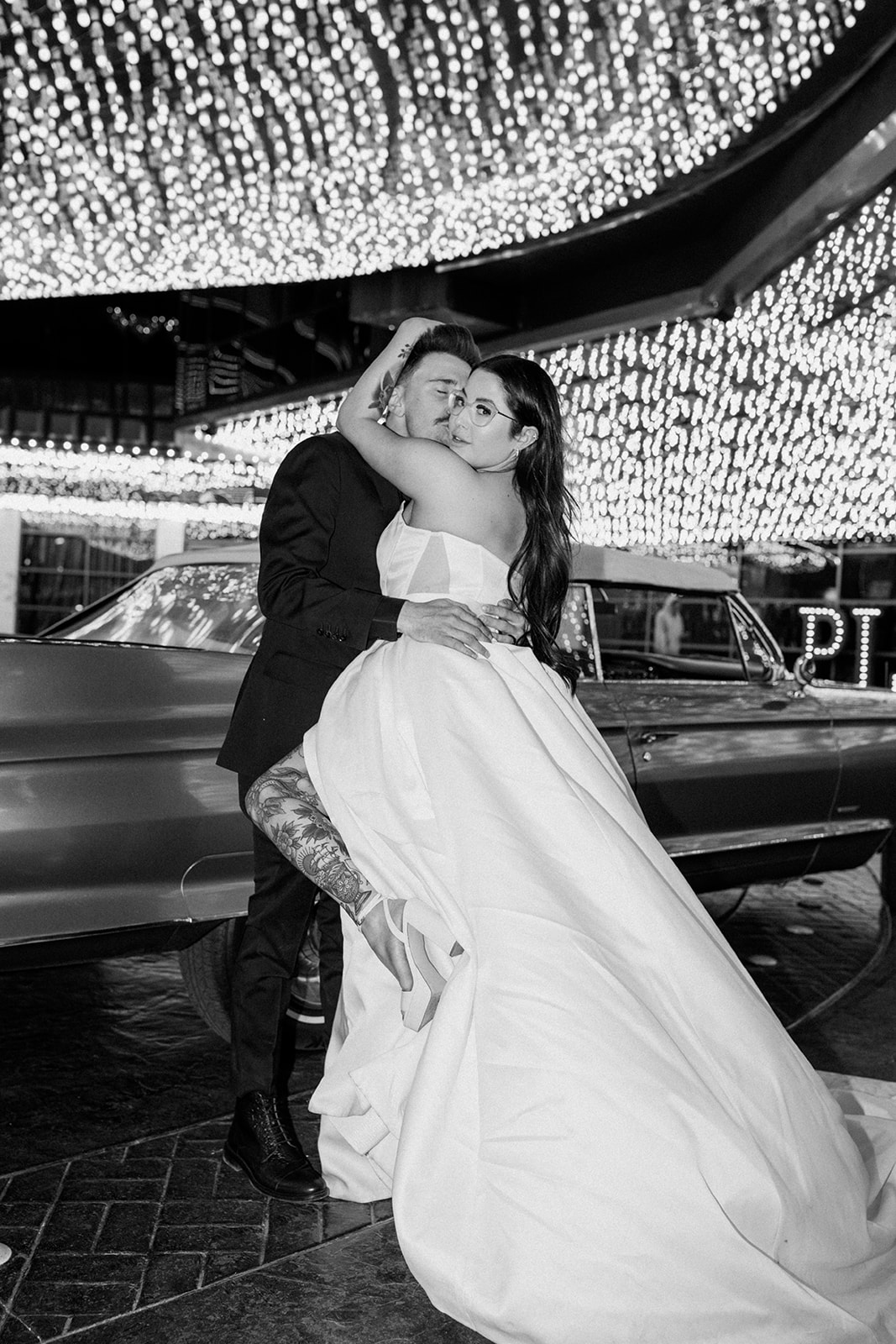 Black and White photo of Newlyweds under Glittery Las Vegas Lights 