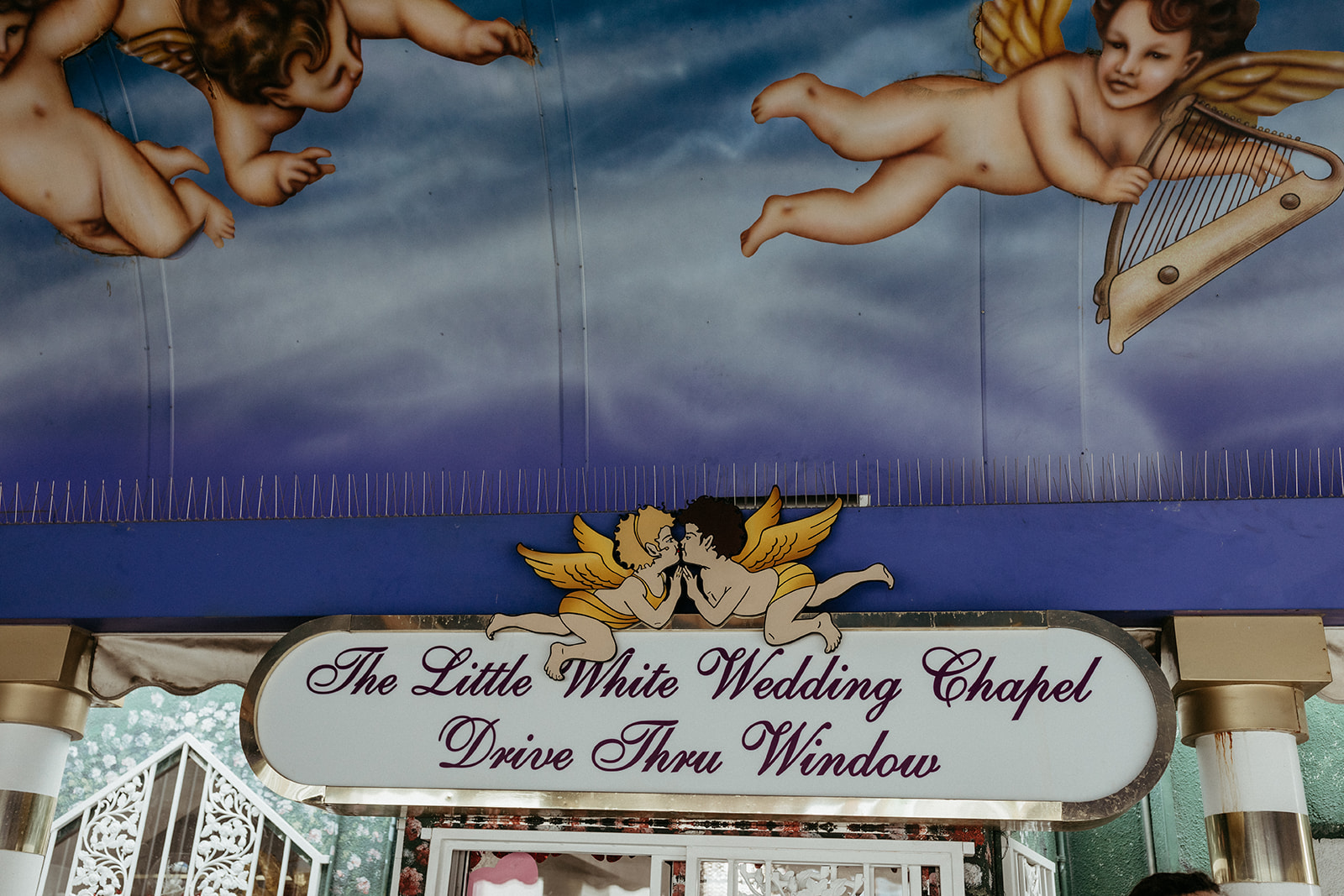 A Little White Wedding Chapel Drive Thru Window Sign in Las Vegas 